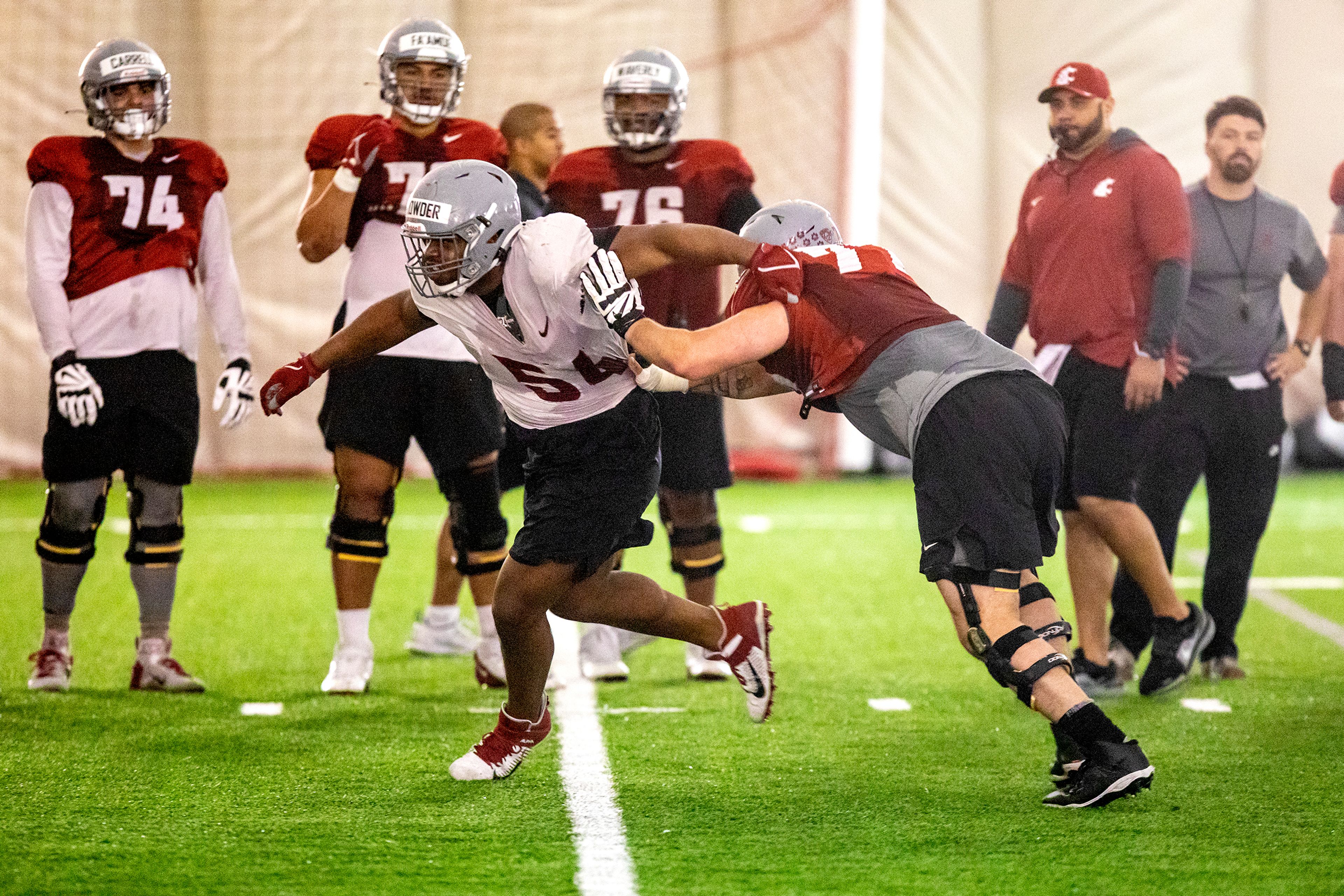 Washington State defensive tackle Ahmir Crowder makes his way around Washington State offensive line Konner Gomness during practice at Washington State University on Thursday.