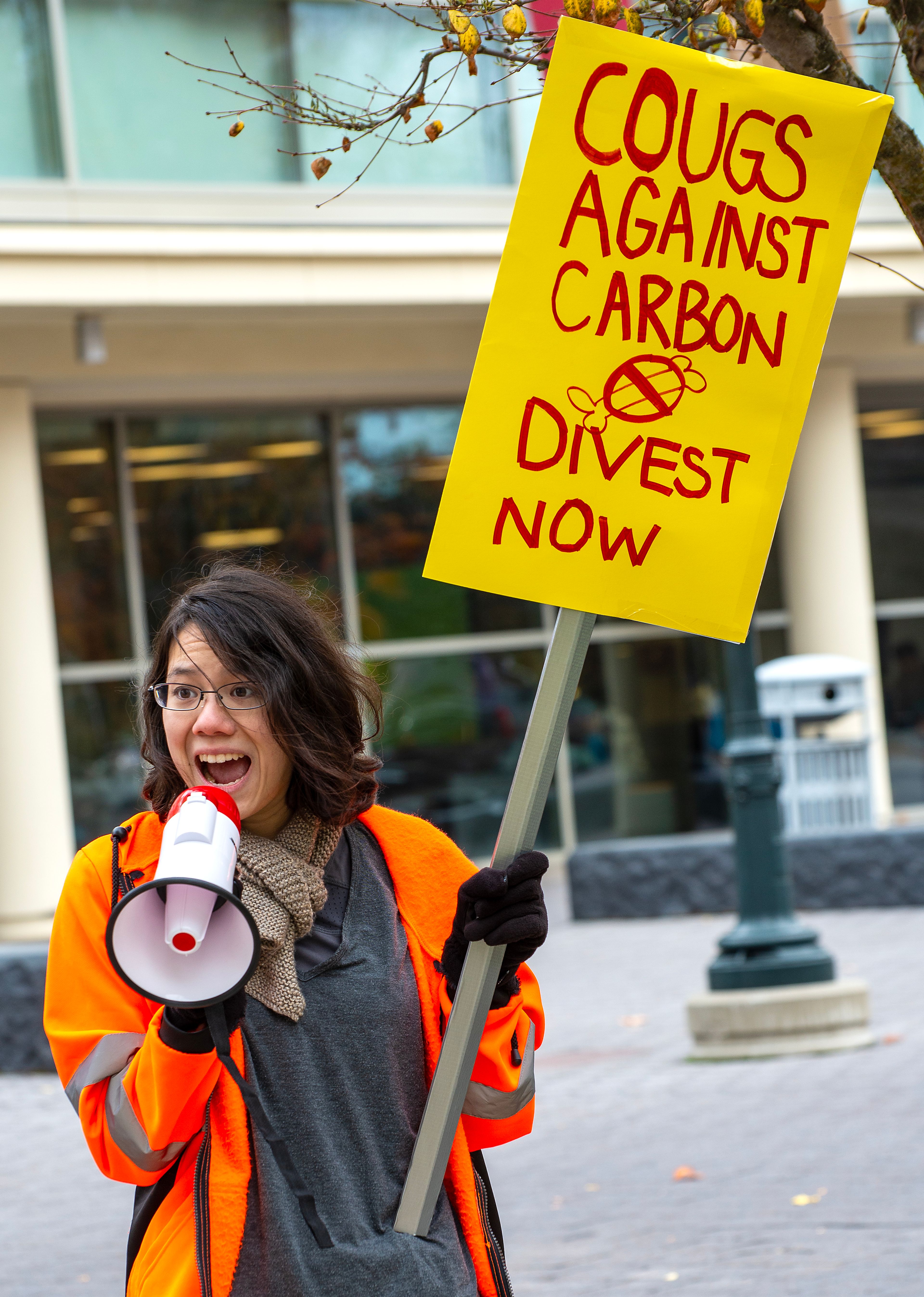 Washington State student Alyx Herring, chairperson of Environmental Sustainability Alliance, speaks Wednesday during a protest calling on WSU to divest from fossil fuels in Pullman.