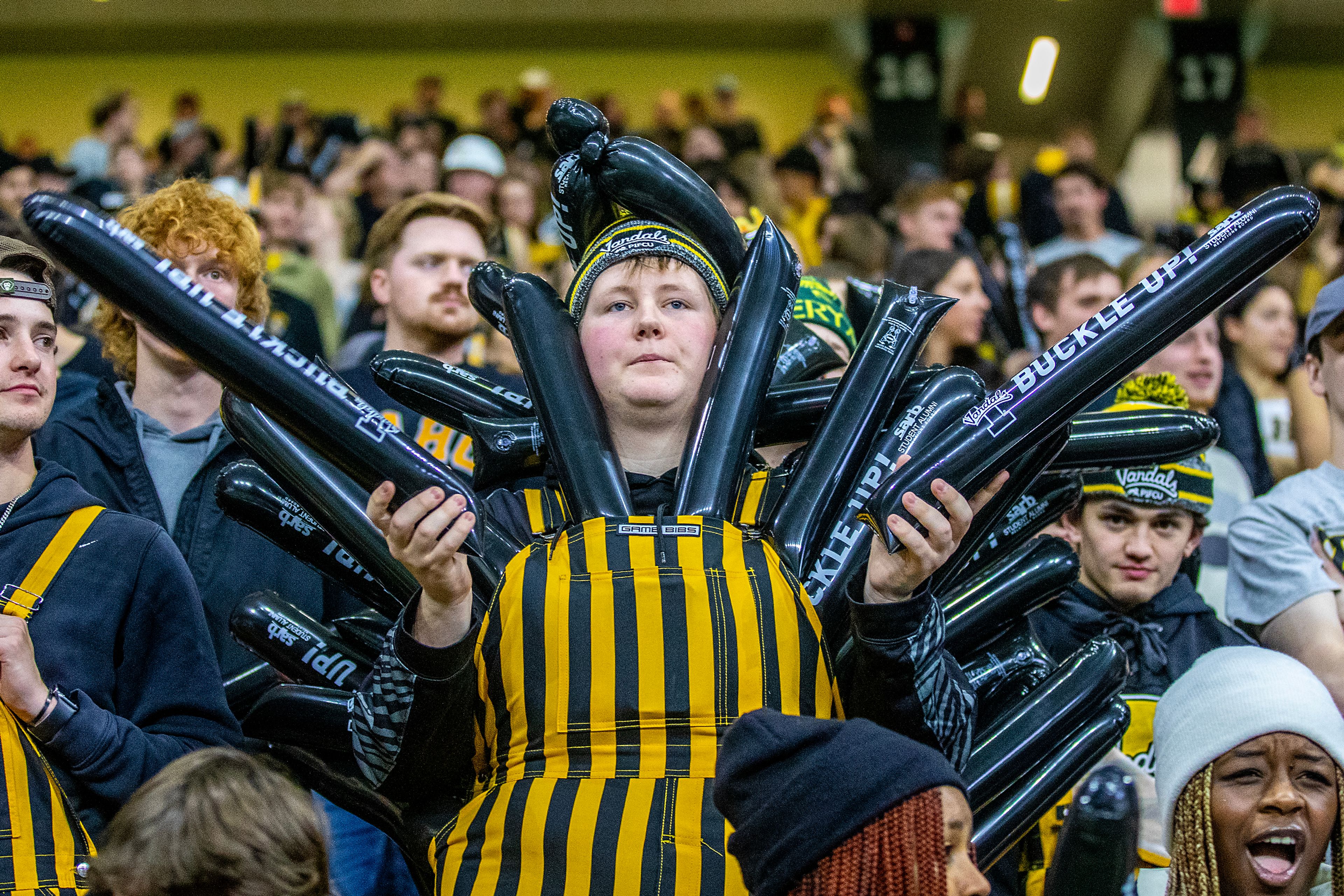 An Idaho fan wears multiple noise makers during the Vandals game against Weber State during a quarter of a Big Sky conference game Saturday at the P1FCU Kibbie Dome in Moscow.