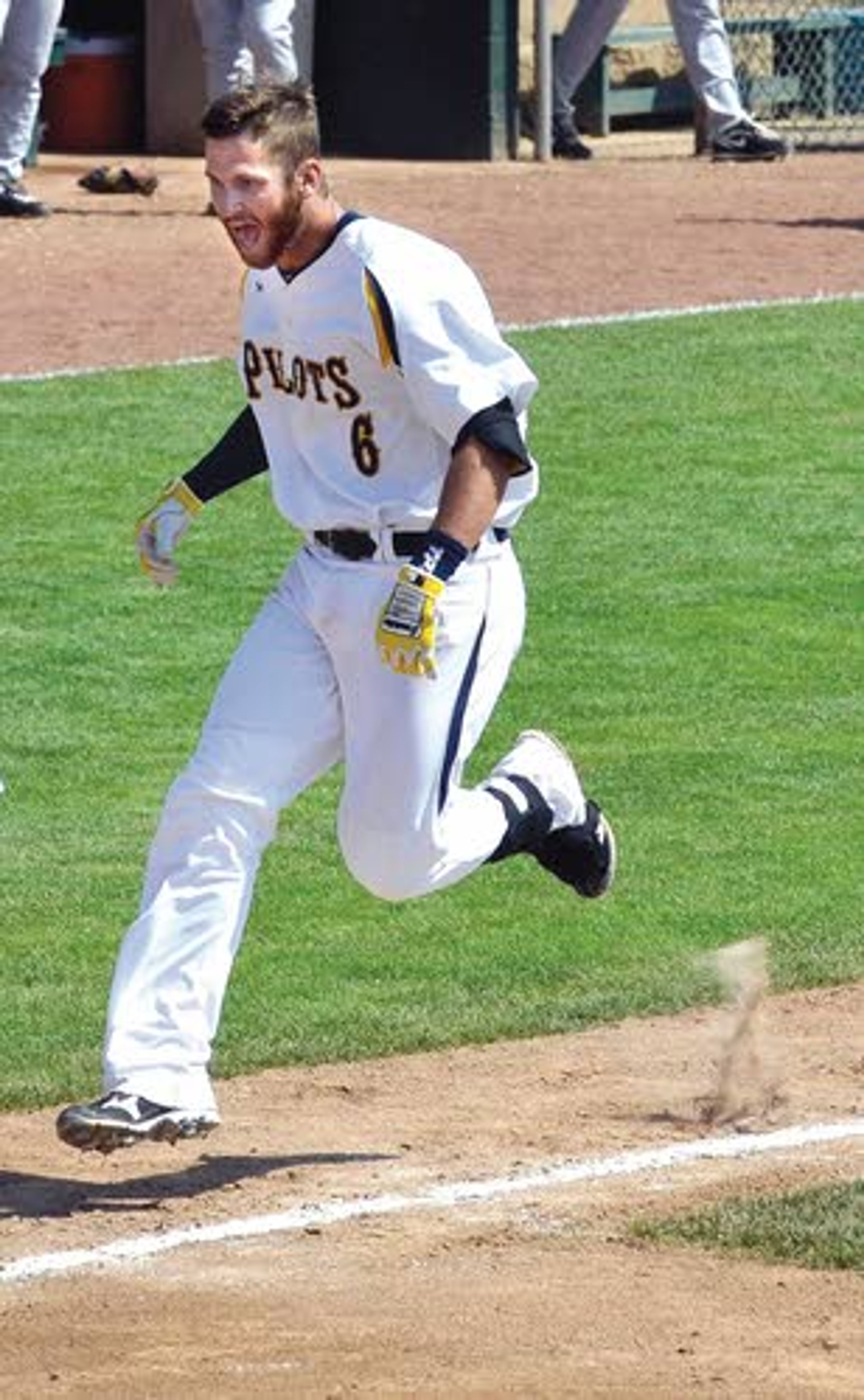 Devin Grecco scampers home to his awaiting team after a walk off grand slam to put away LCSC in the bottom of the ninth.