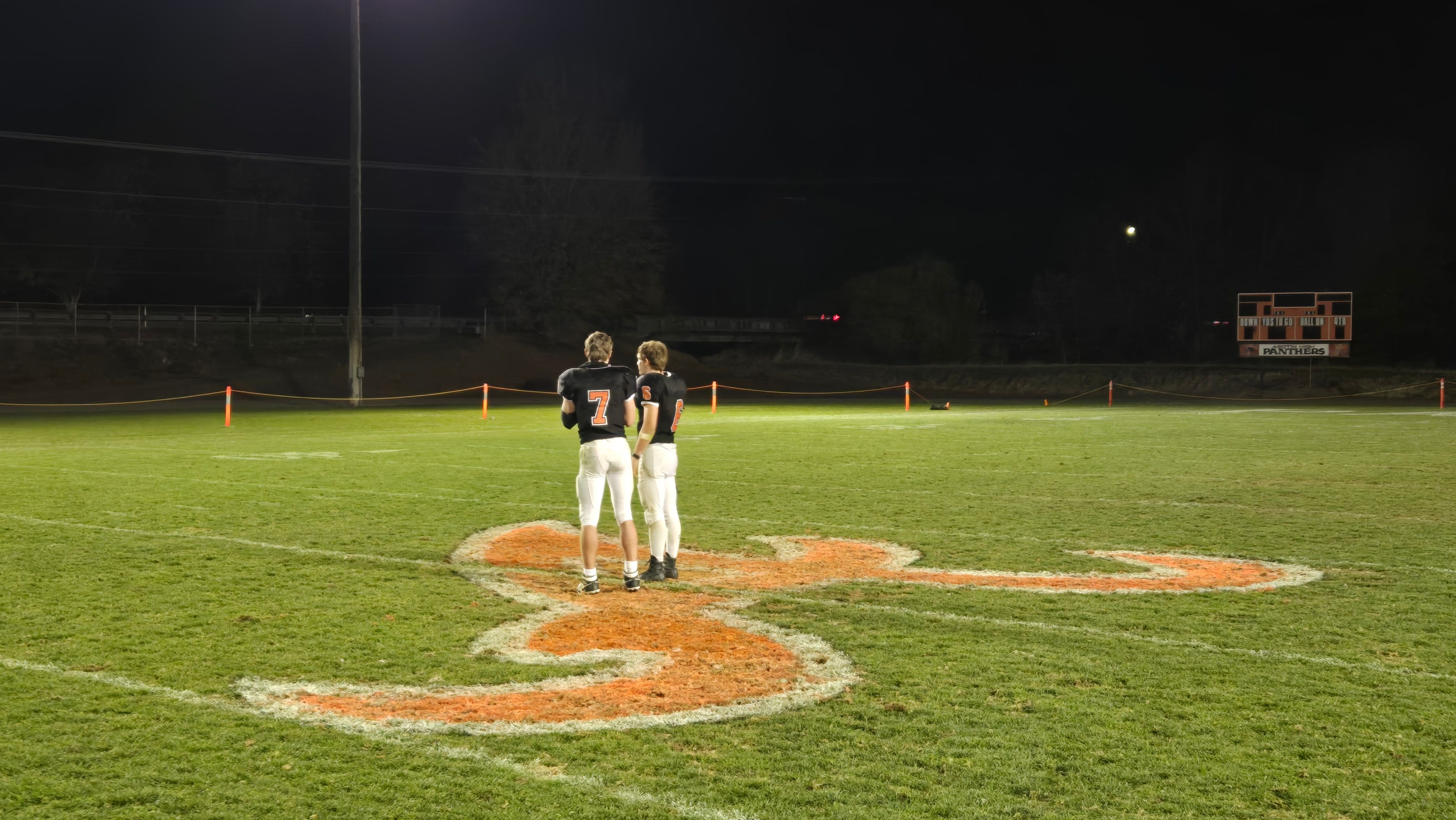 Asotin quaterback Cody Ells (left) and running back Peter Eggleston stand at midfield following the Panthers’ 29-26 state playoff win over Cle Elum on Saturday in Asotin.