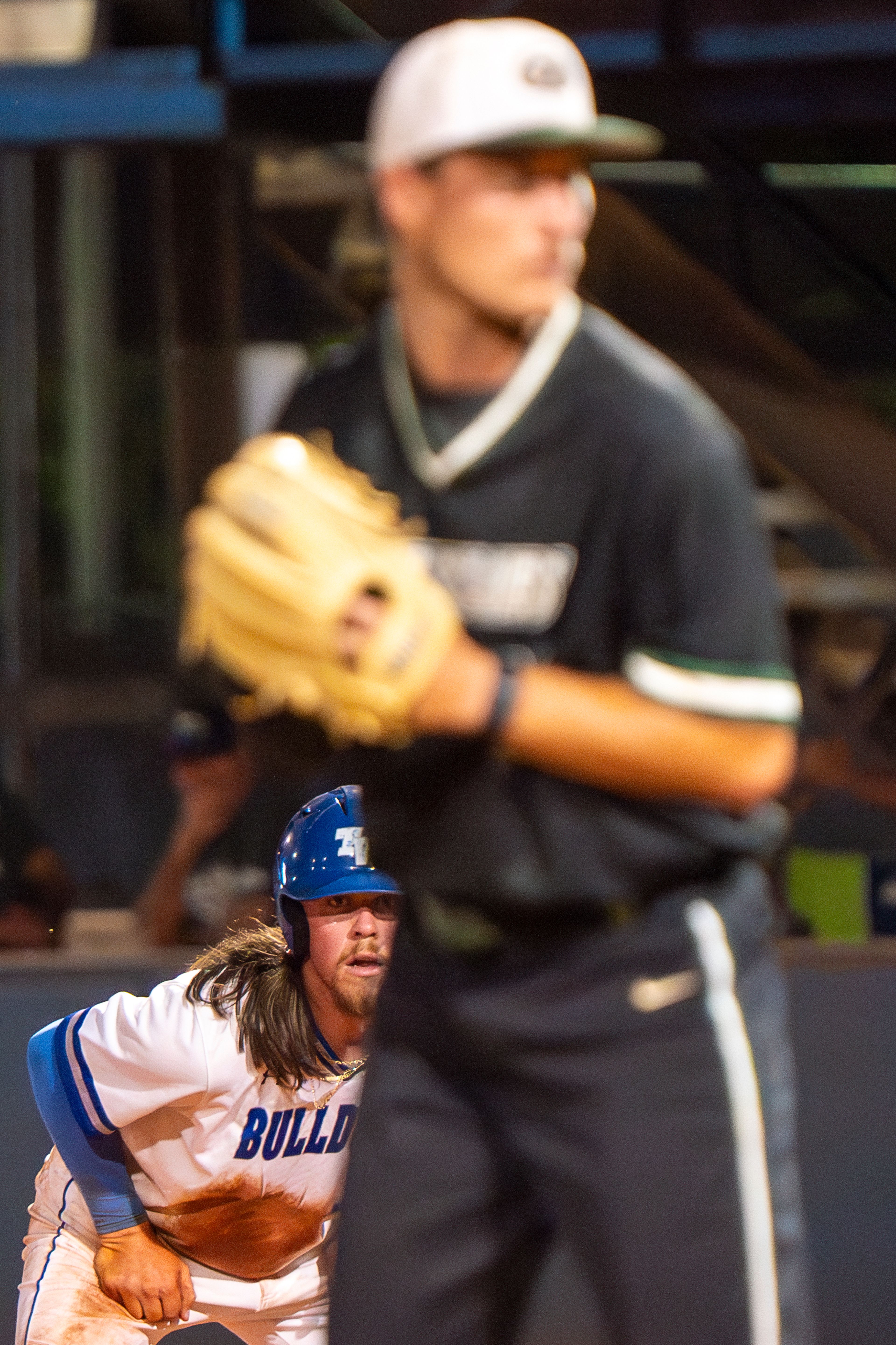 Tennessee Wesleyan’s Evan Magill, left, leads off of first base during Game 12 of the NAIA World Series against Georgia Gwinnett on Monday at Harris Field in Lewiston.