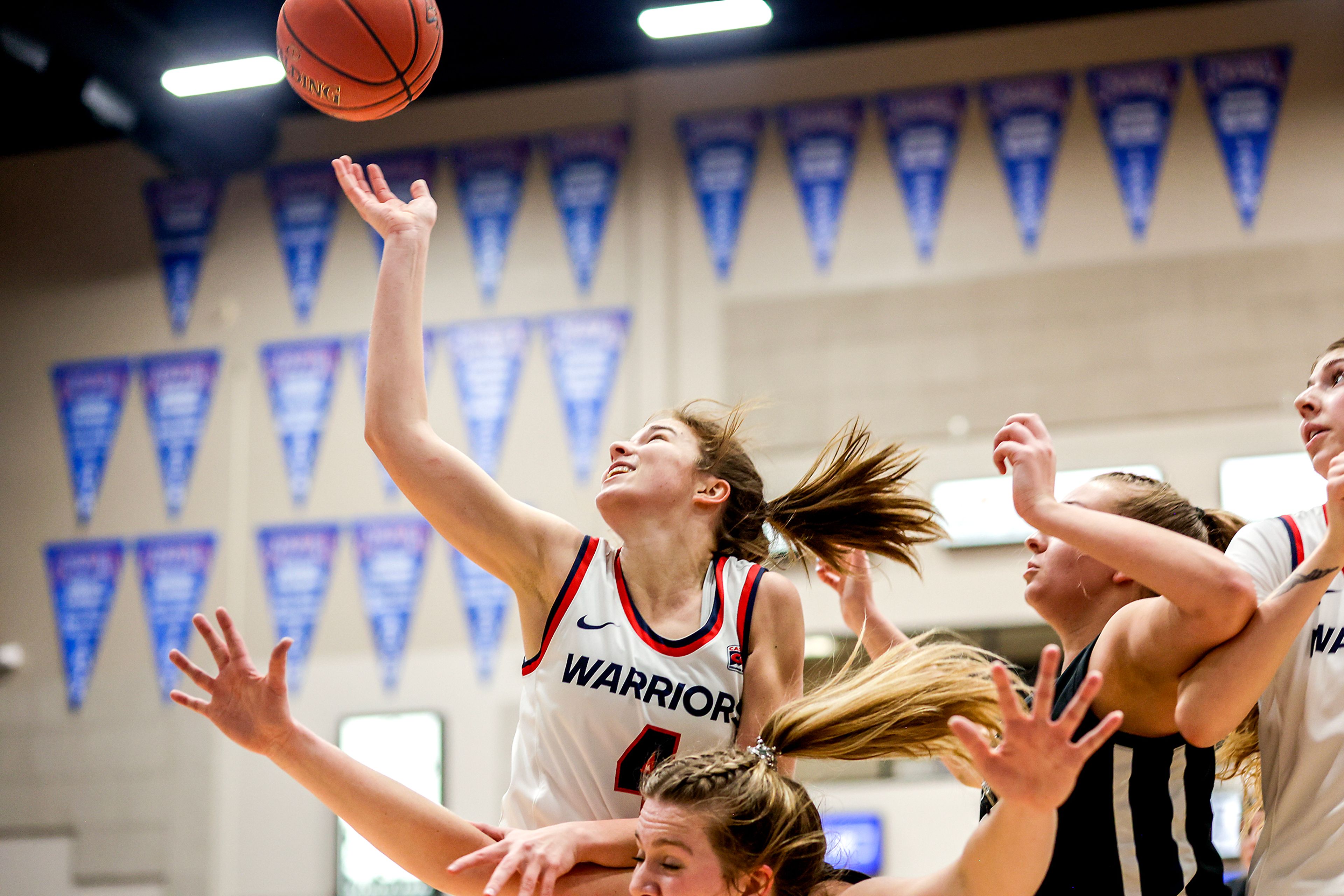 Lewis-Clark State guard Ellie Sander shoots as she comes down on an Eastern Oregon player during Friday’s Cascade Conference game at the P1FCU Activity Center. Sander finished with 19 points as the 10th-ranked Warriors beat the 20th-ranked Mounties.