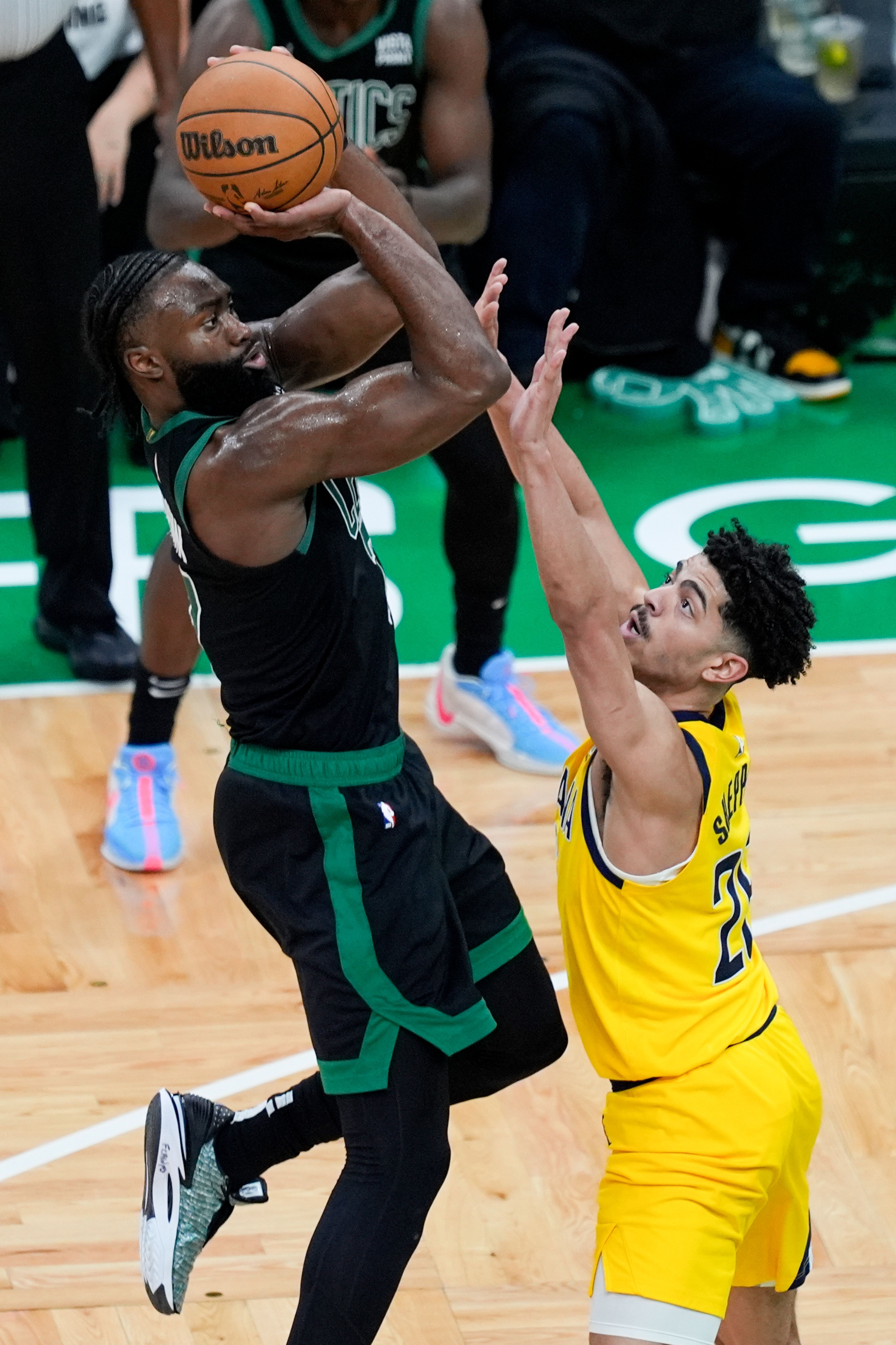 Celtics guard Jaylen Brown, left, shoots over Pacers guard Ben Sheppard during the second half of Game 2 of the Eastern Conference finals Thursday in Boston.