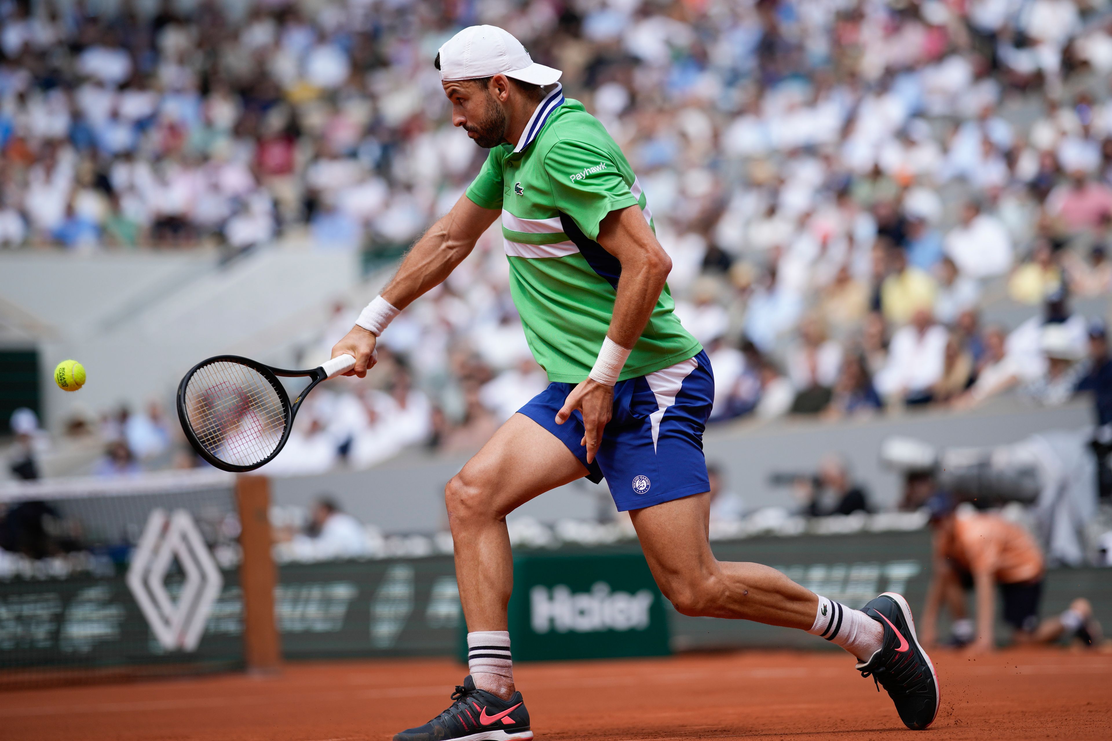 Bulgaria's Grigor Dimitrov plays a shot against Italy's Jannik Sinner during their quarterfinal match of the French Open tennis tournament at the Roland Garros stadium in Paris, Tuesday, June 4, 2024.