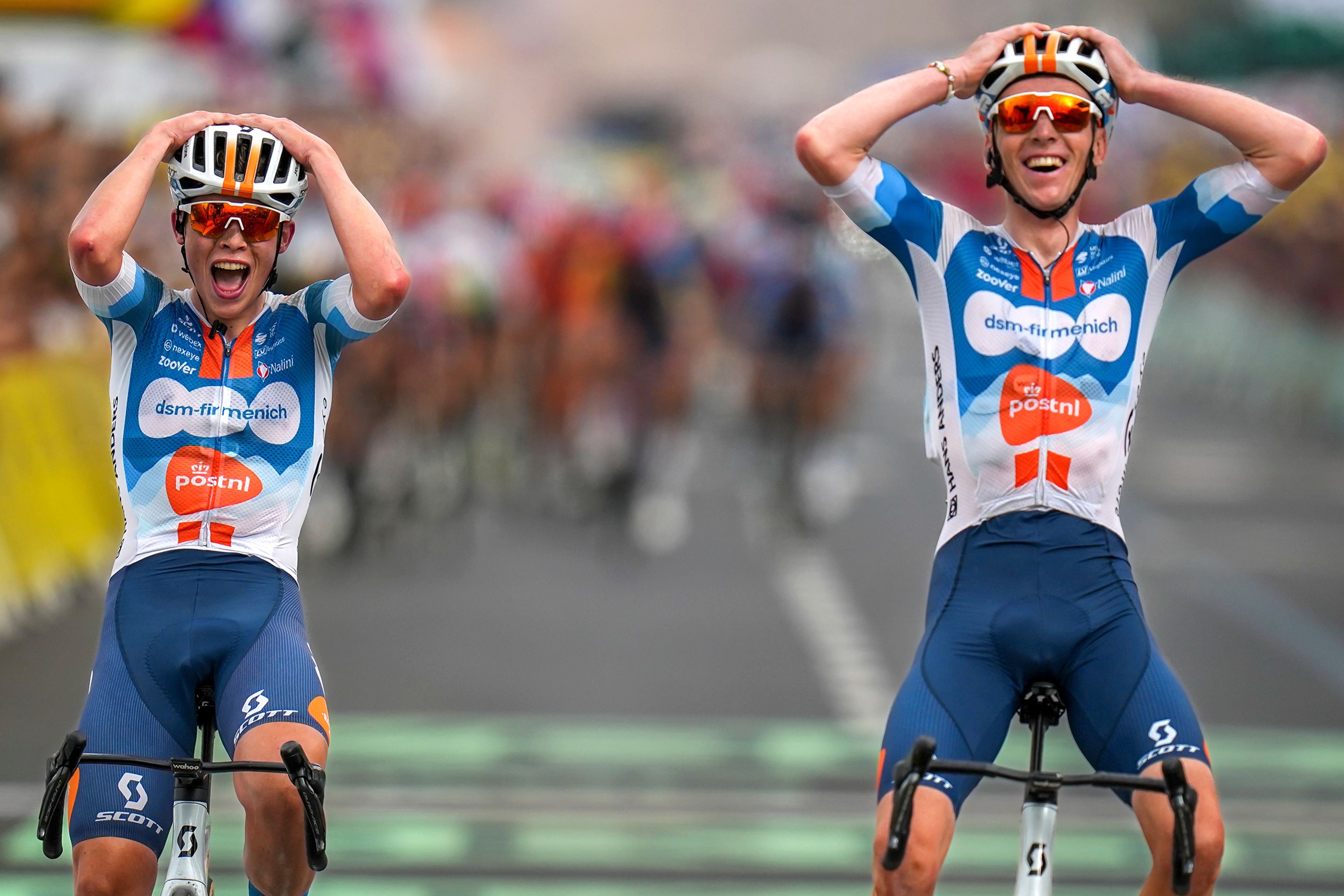 Team dsm–firmenich PostNL’s Romain Bardet, right, of France, crosses the finish line with teammate Frank van den Broek, of Netherlands, to win the first stage of the Tour de France over 206 kilometers with start in Florence and finish in Rimini, Italy, Saturday, June 29, 2024. The Tour, one of the three Grand Tours, along with the Giro d’Italia and Vuelta a España, takes place over three weeks, 21 stages, and is regarded as the biggest race in cycling. (AP Photo/Daniel Cole)