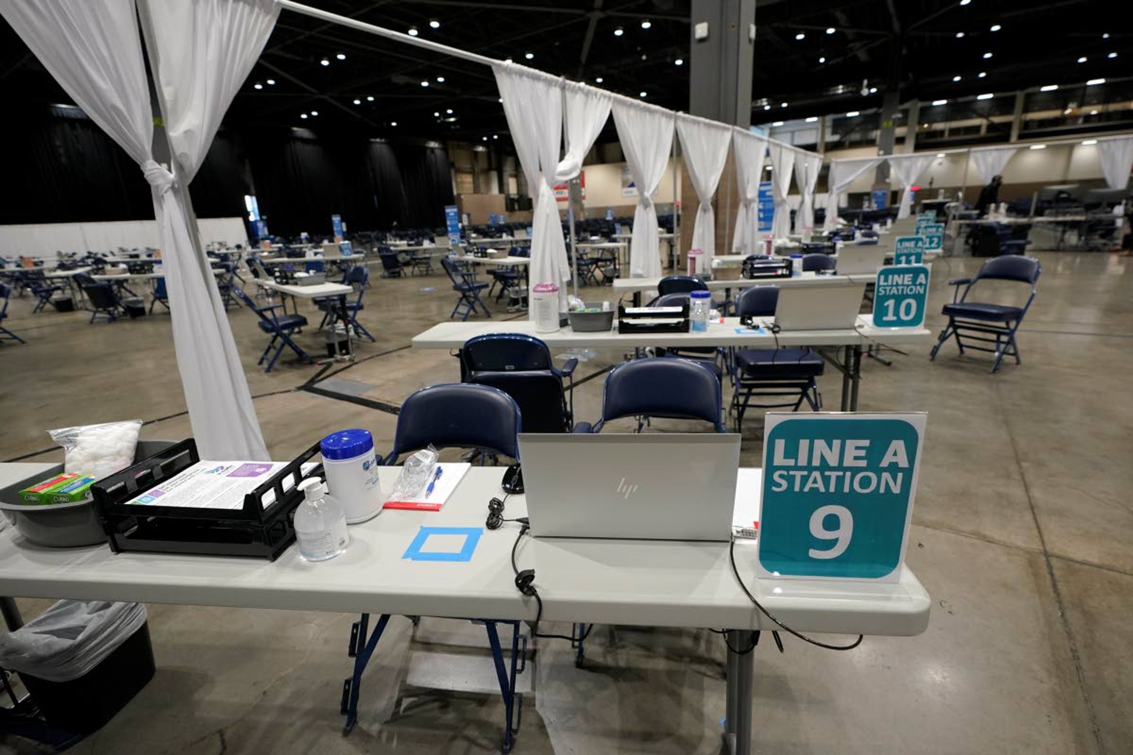 Stations where COVID-19 vaccines will be administrated are shown set up at a mass vaccination site Wednesday at the Lumen Field Events Center in Seattle. Seattle Mayor Jenny Durkan and other officials announced that the site would begin operation Saturday, and said it would be the largest civilian-led vaccination site in the country.