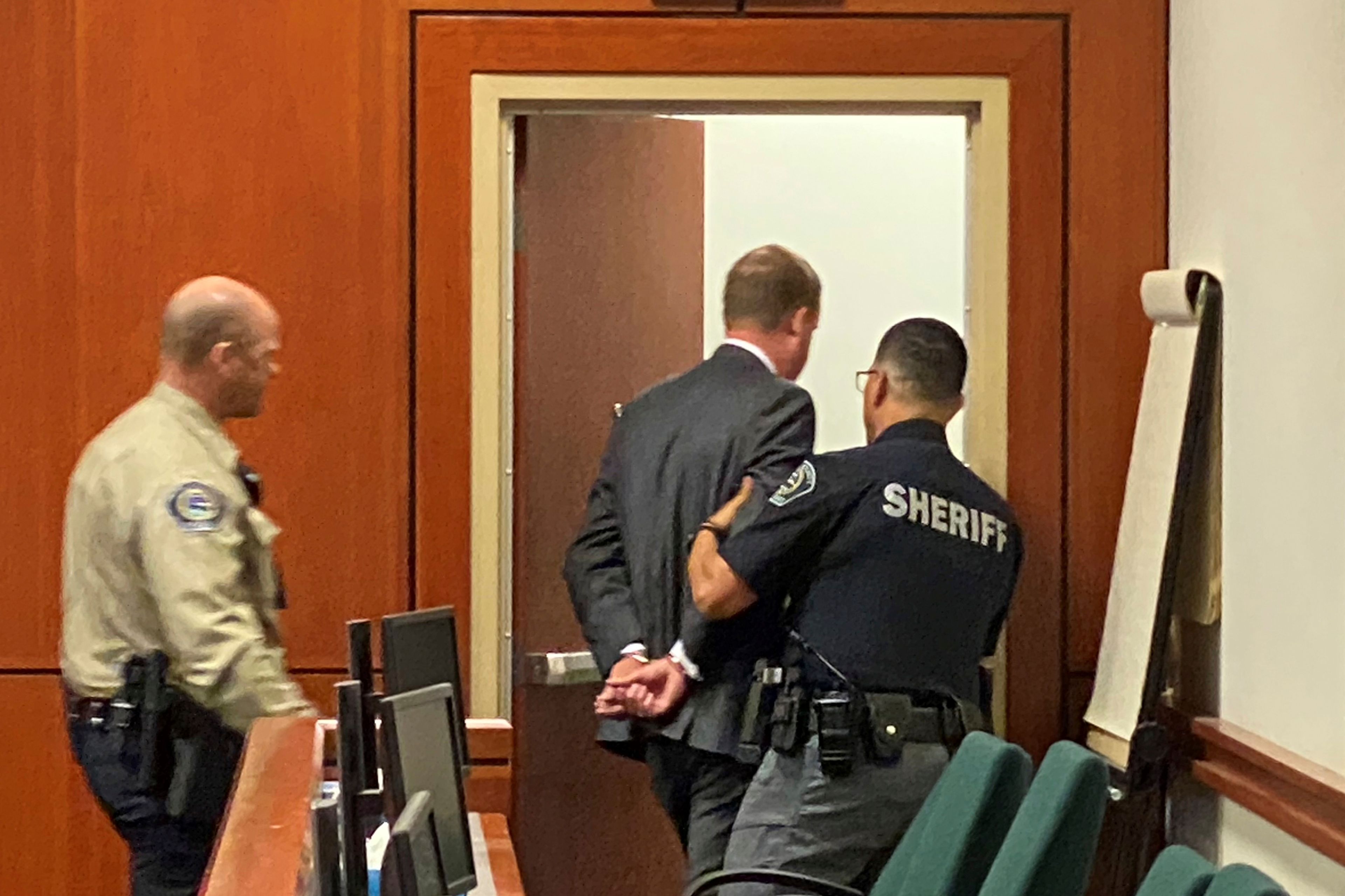 Former Idaho state Rep. Aaron von Ehlinger is led out of the courtroom Friday in Boise.