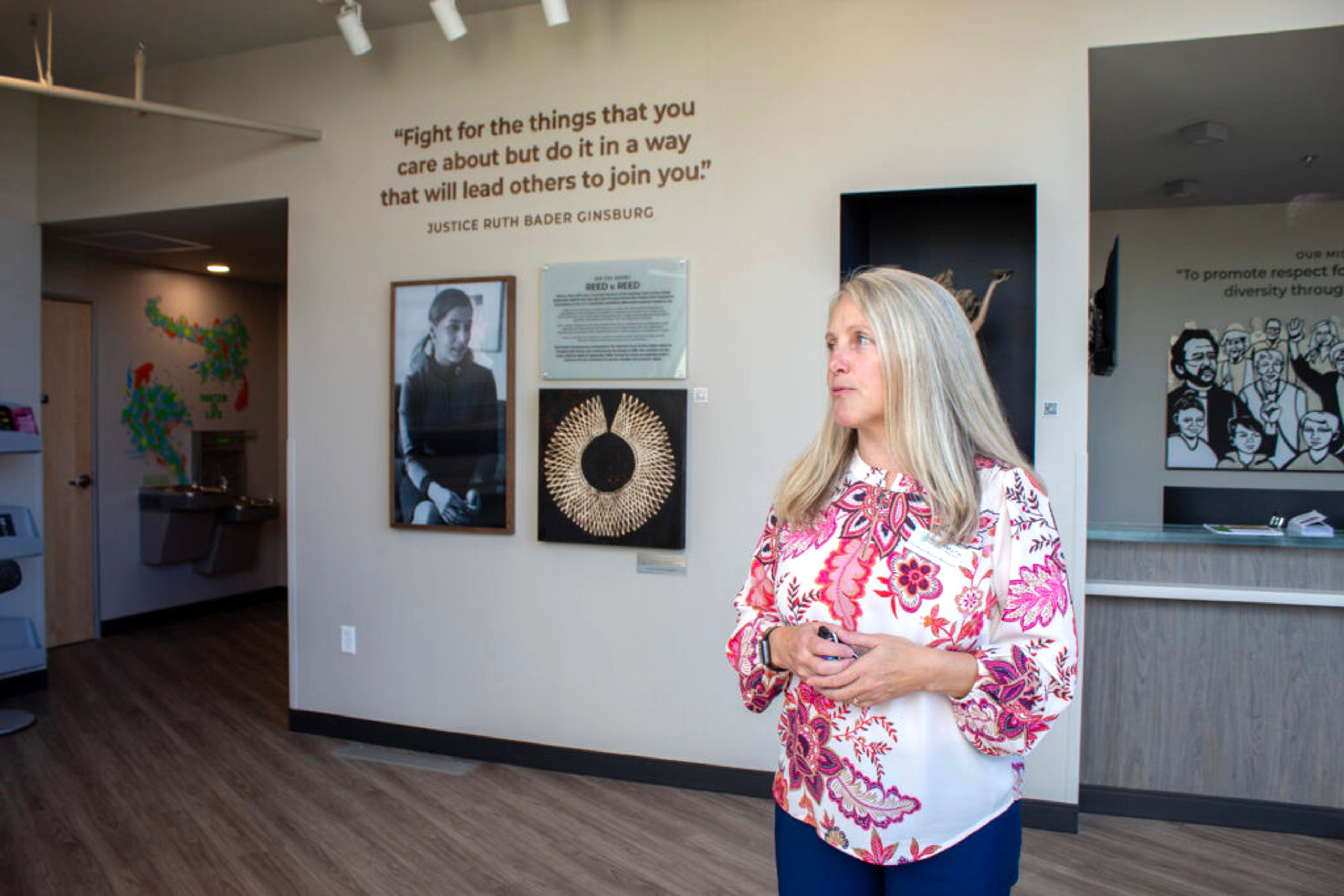 Christina Bruce-Bennion, executive director of the Wassmuth Center for Human Rights, gives members of the media a tour of the new Philip E. Batt building. (Mia Maldonado/Idaho Capital Sun)