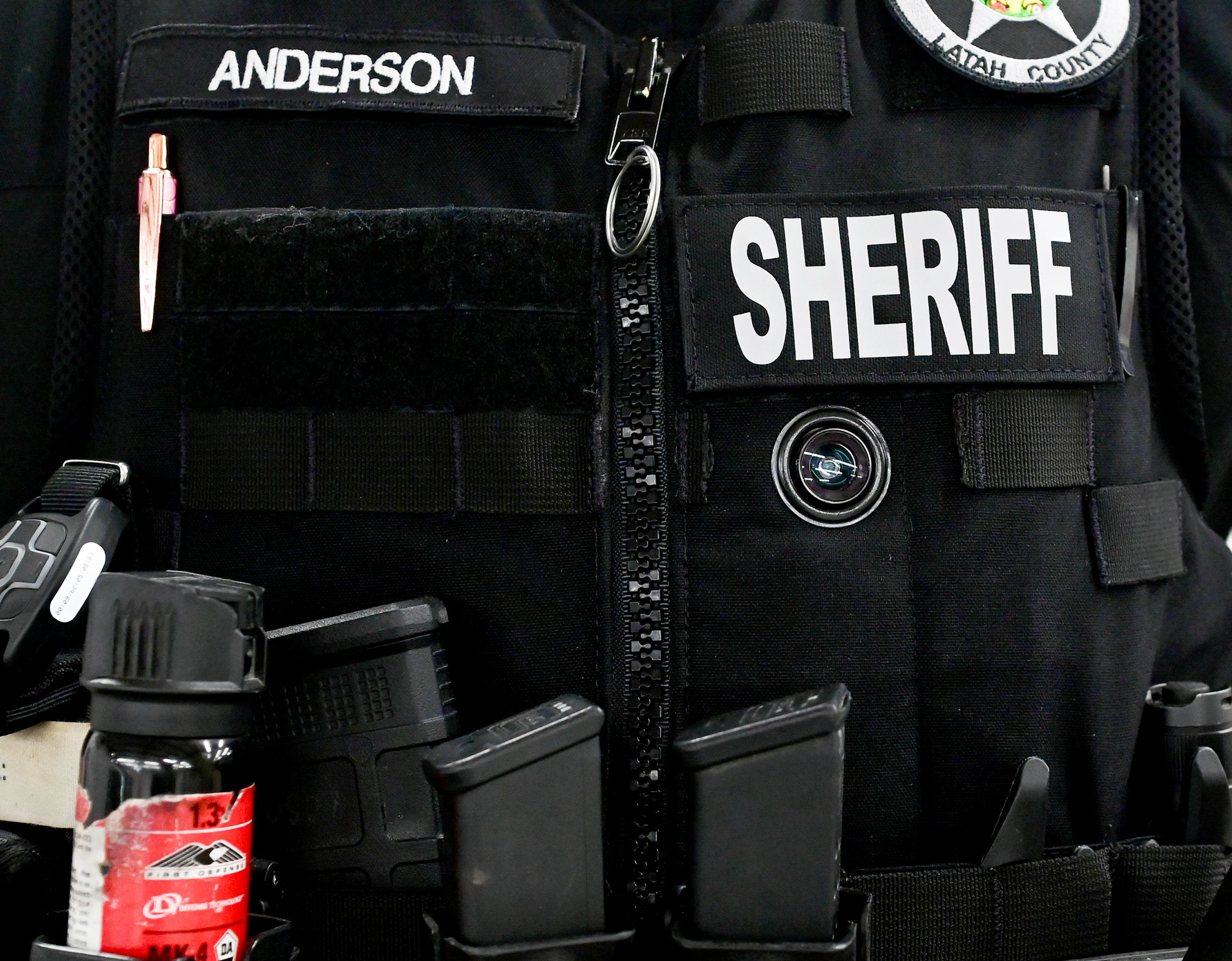 The eyepiece of one of the Latah County Sheriff’s Office new body cameras, right, is visible from the front of a vest on Thursday.