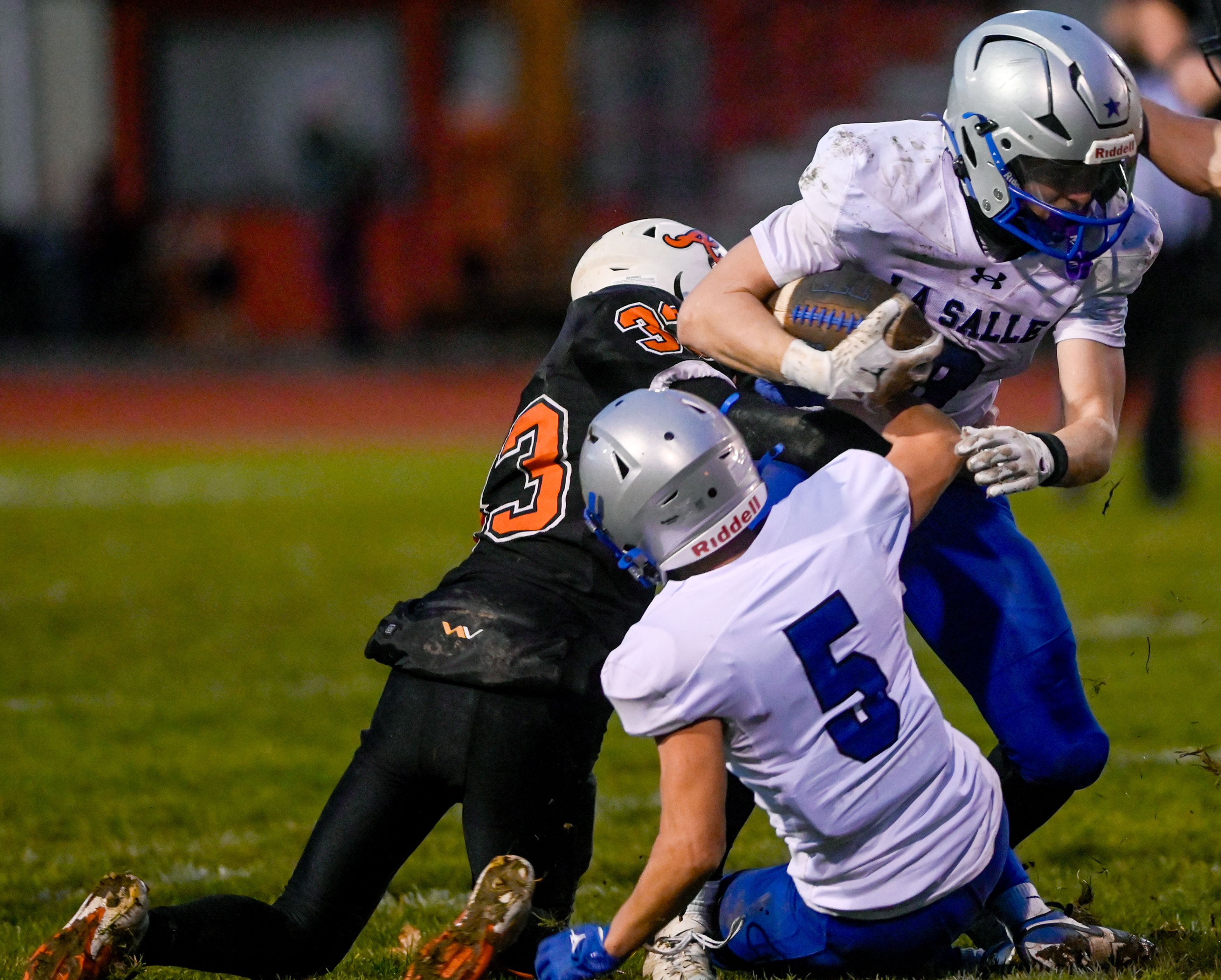 Asotin’s Cannon Shubert tackles La Salle’s Kai Hanrahan Saturday during a Washington 2B state tournament game in Clarkston.