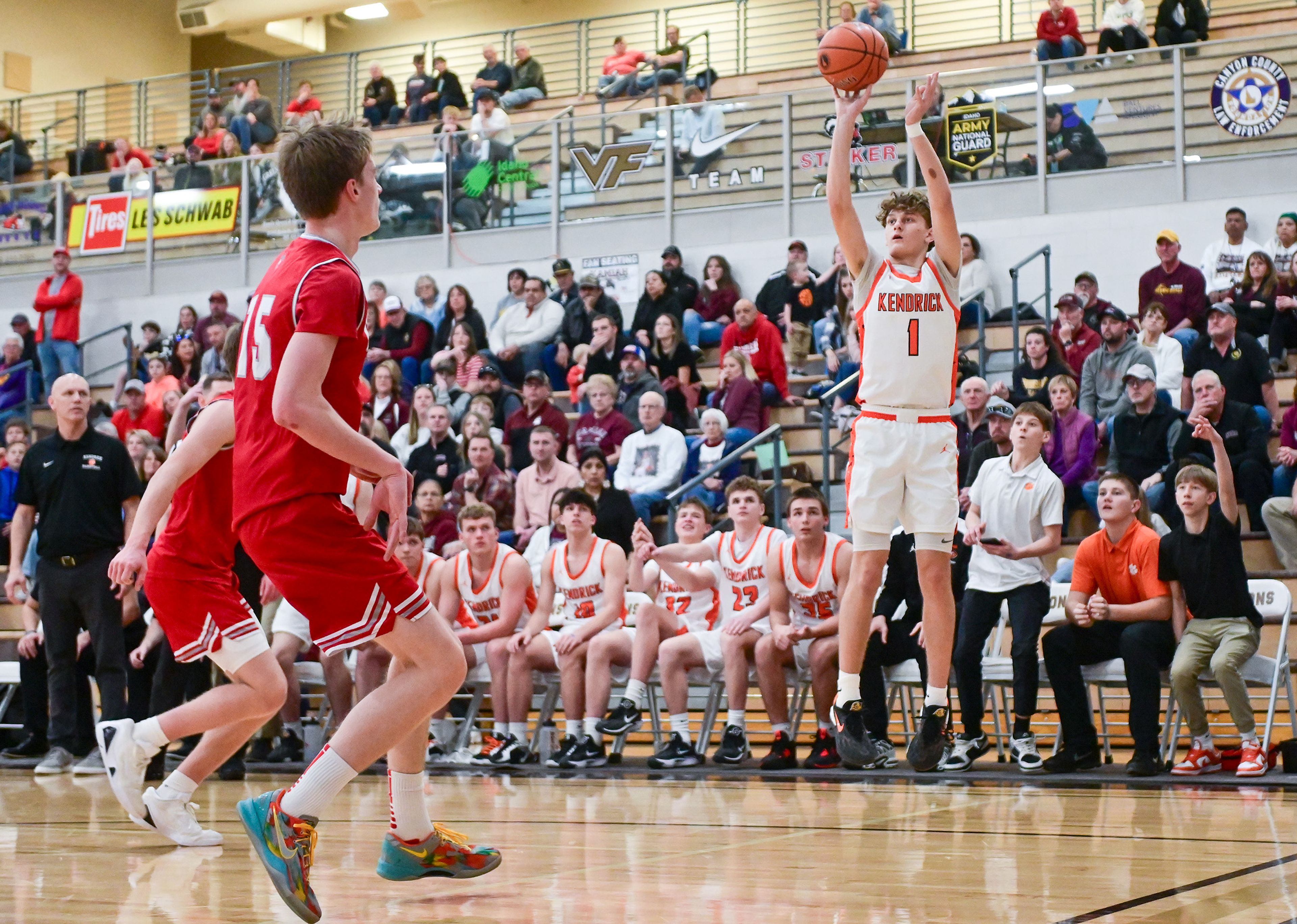 Kendrick's Cade Silflow releases a three-point shot against Grace at the Idaho 2A state tournament on Friday in Caldwell, Idaho.