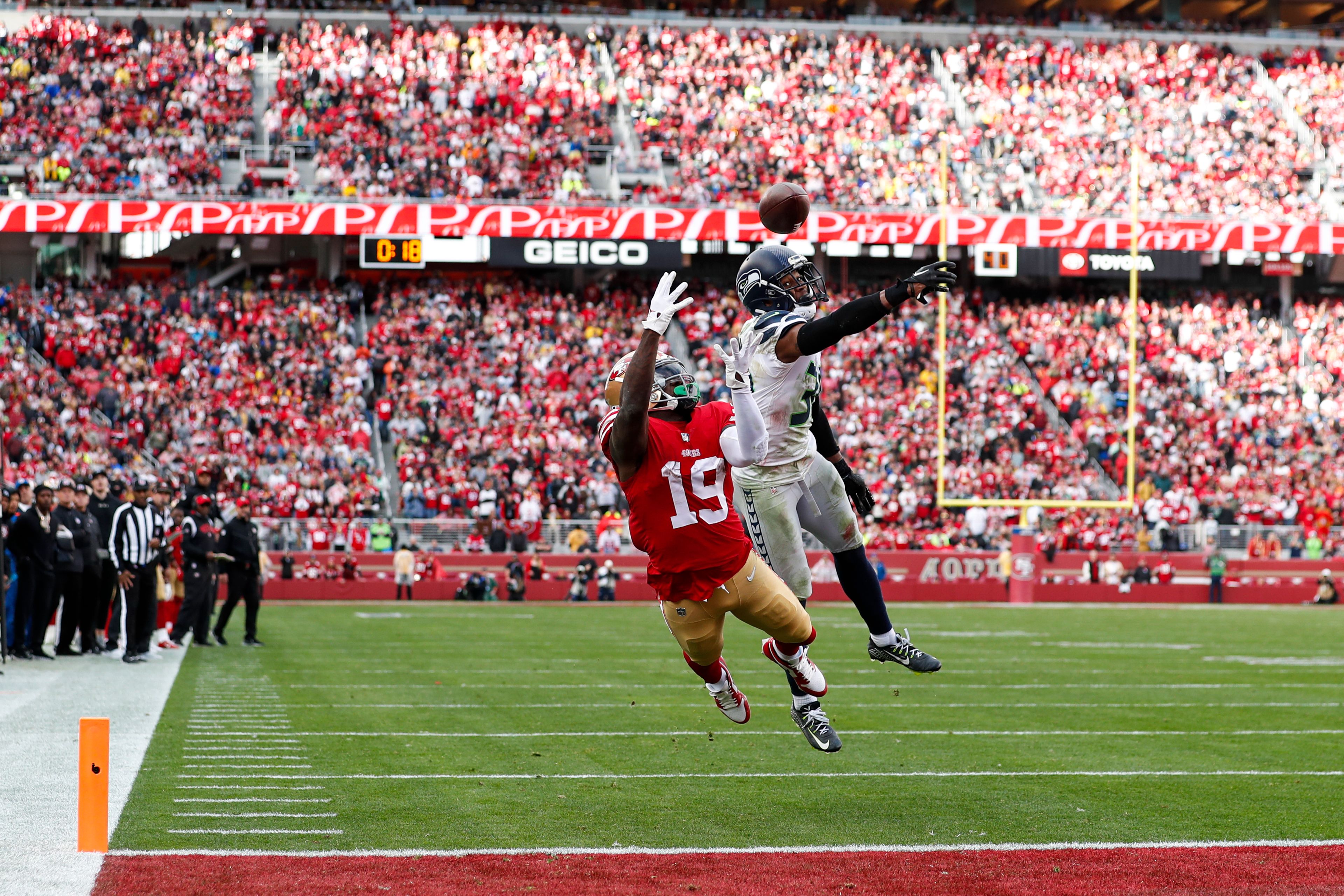 Seattle Seahawks cornerback Mike Jackson, right, breaks up a pass intended for San Francisco 49ers wide receiver Deebo Samuel (19) during the first half of an NFL wild card playoff football game in Santa Clara, Calif., Saturday, Jan. 14, 2023. (AP Photo/Jed Jacobsohn)