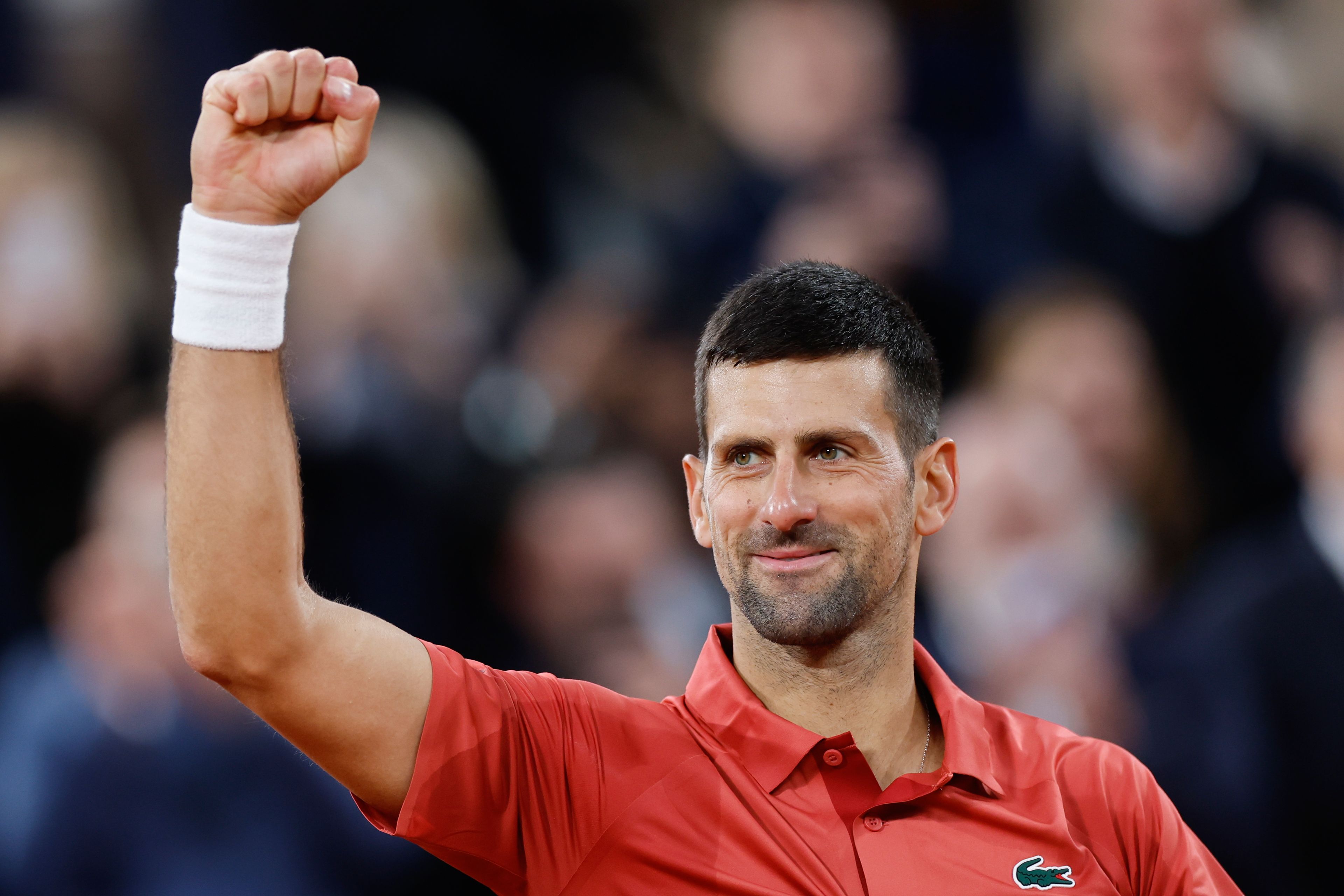 Serbia's Novak Djokovic celebrates winning his second round match of the French Open tennis tournament against Spain's Roberto Carballes Baena at the Roland Garros stadium in Paris, Thursday, May 30, 2024.