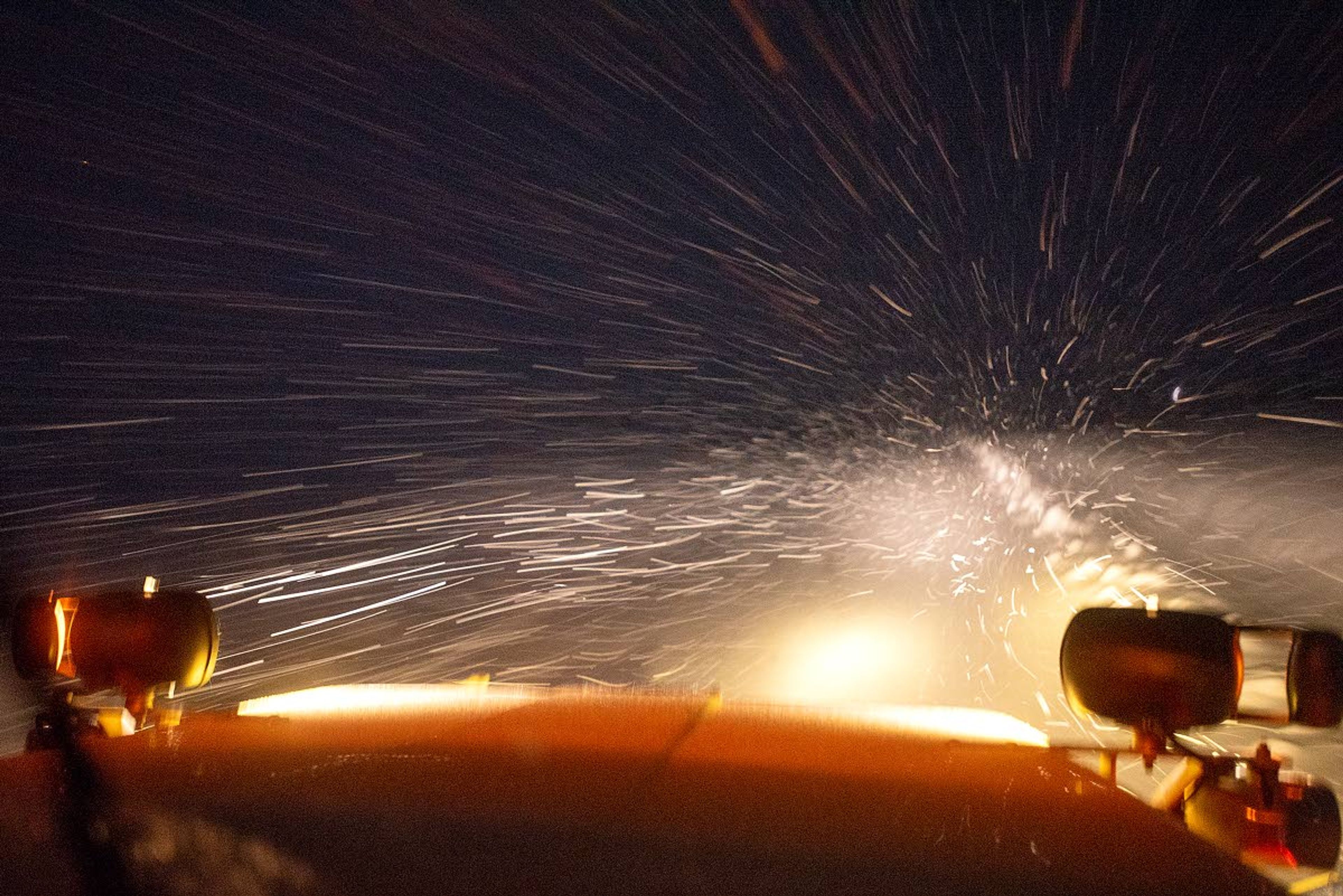 Snowflakes whisk across the windshield of Cody Bailey's plow as he clears off a section of highway northeast of Genesee on Wednesday morning.