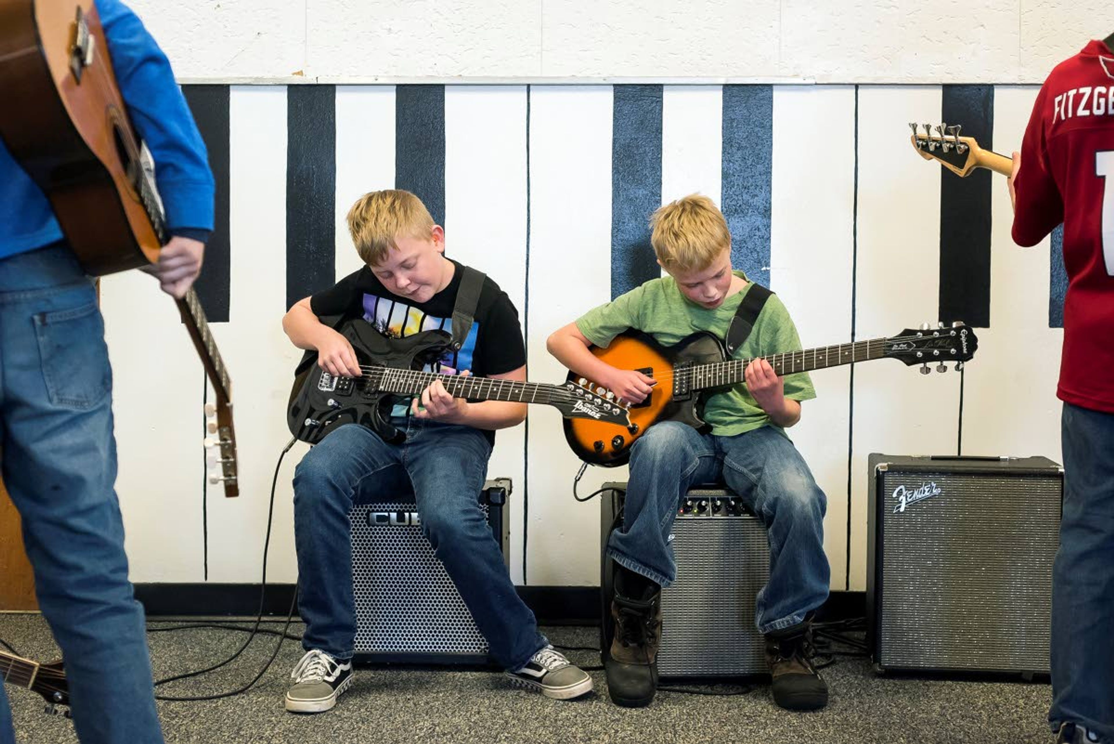 Zane Wilcox (left) and Noah Johnson, of the heavy metal band “Trailer Park Boyz,” practice guitar between song rehearsals during modern band class at Nezperce School on Tuesday in Nezperce.