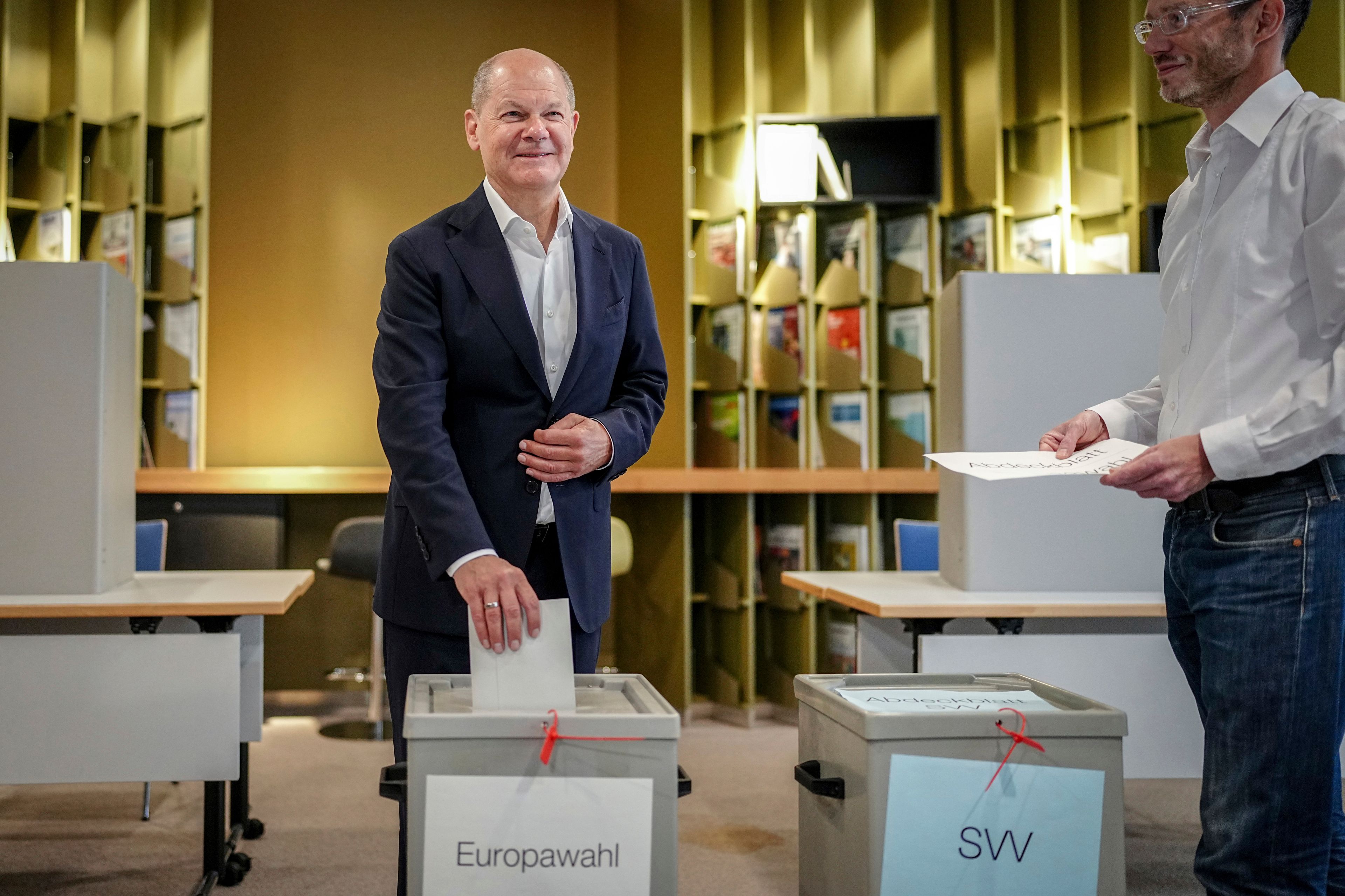 German Chancellor Olaf Scholz casts his ballot for the European Parliament elections, in Potsdam, Germany, Sunday, June 9, 2024. Tens of millions across the European Union were voting in EU parliamentary elections on Sunday in a massive exercise of democracy that is expected to shift the bloc to the right and redirect its future.