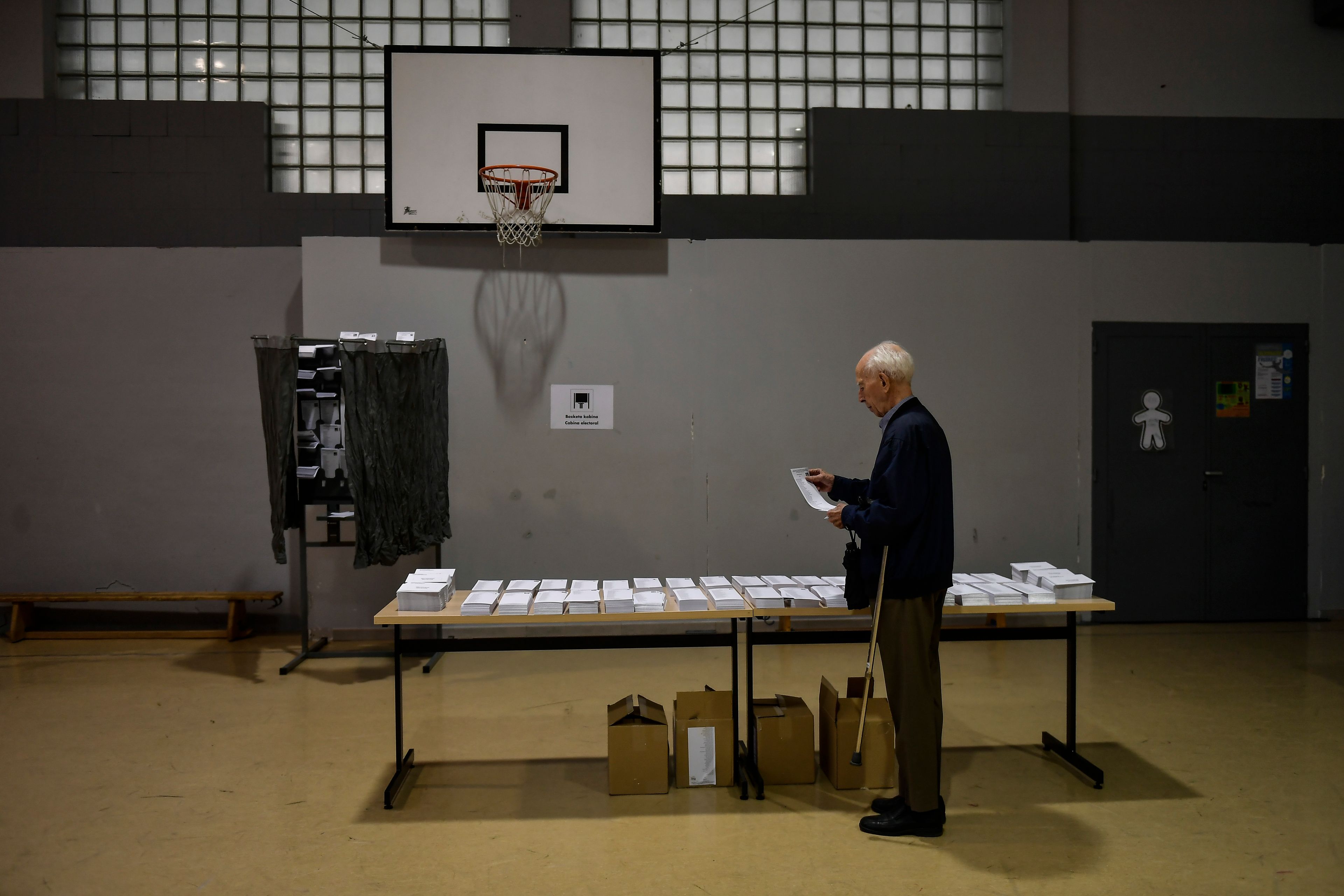 A voter picks a ballot paper at a polling station in Pamplona, northern Spain, on Sunday, June 9, 2024. Pivotal elections for the European Union parliament reach their climax Sunday as the 27 nations go to the polls and results are announced in a vote that boils down to a continent-wide battle between eurosceptic populists and proponents of closer EU unity.