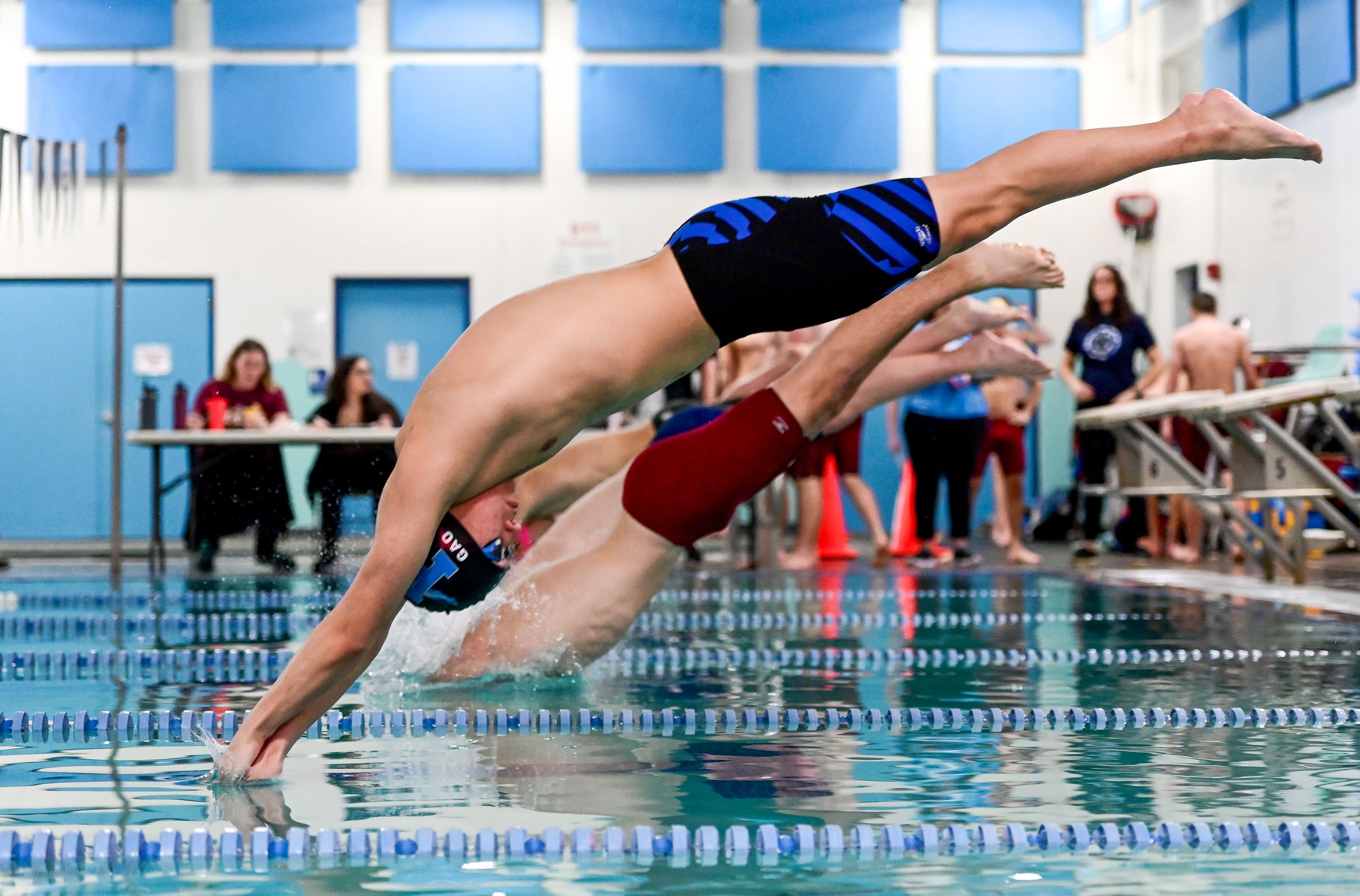 Pullman sophomore Luke Gao dives into the pool at the start of a 100-yard freestyle heat in Pullman on Tuesday.