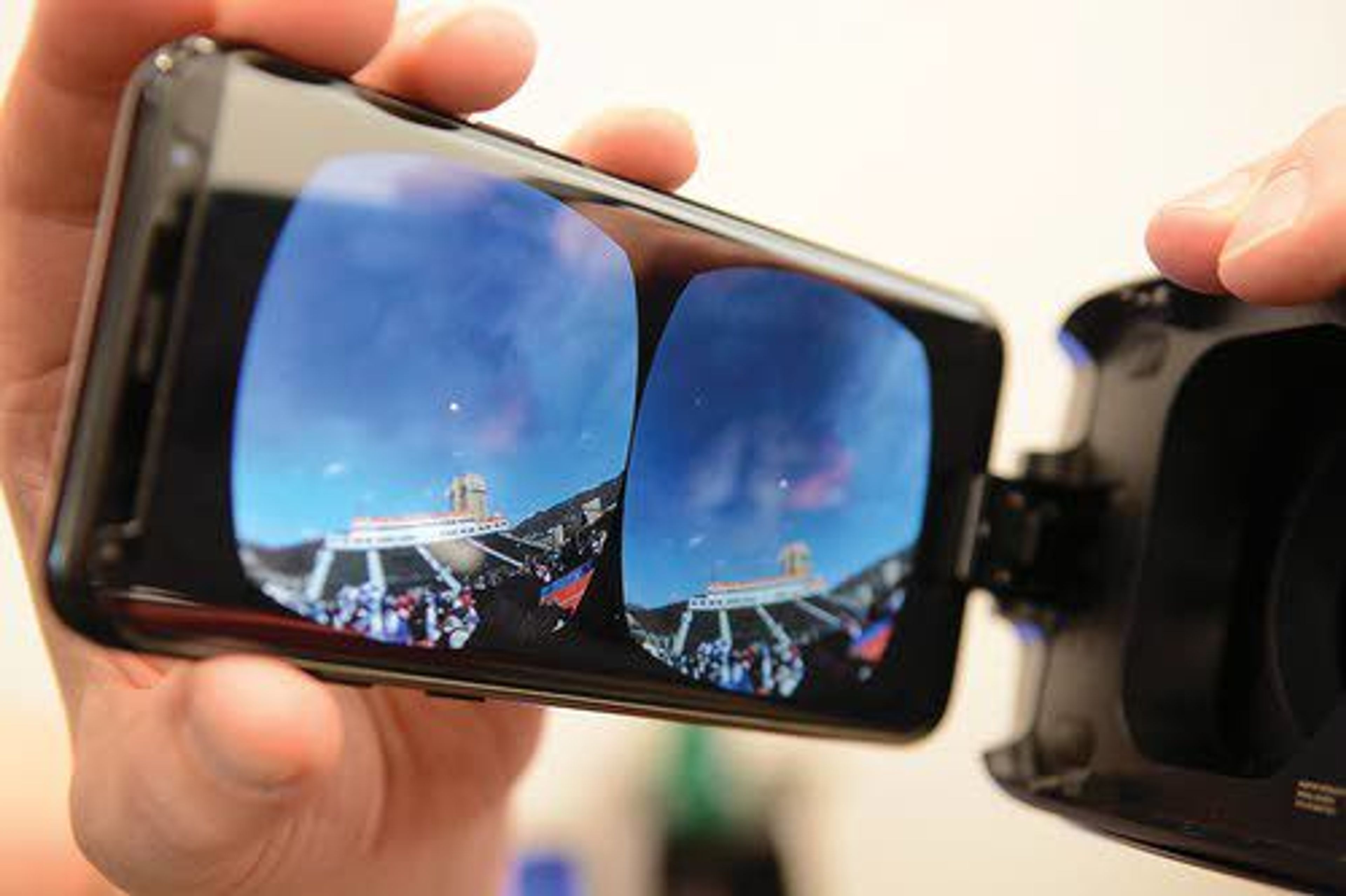 Images displayed on a cellphone are magnified by fresnel lenses into the hood, providing a very real experience.