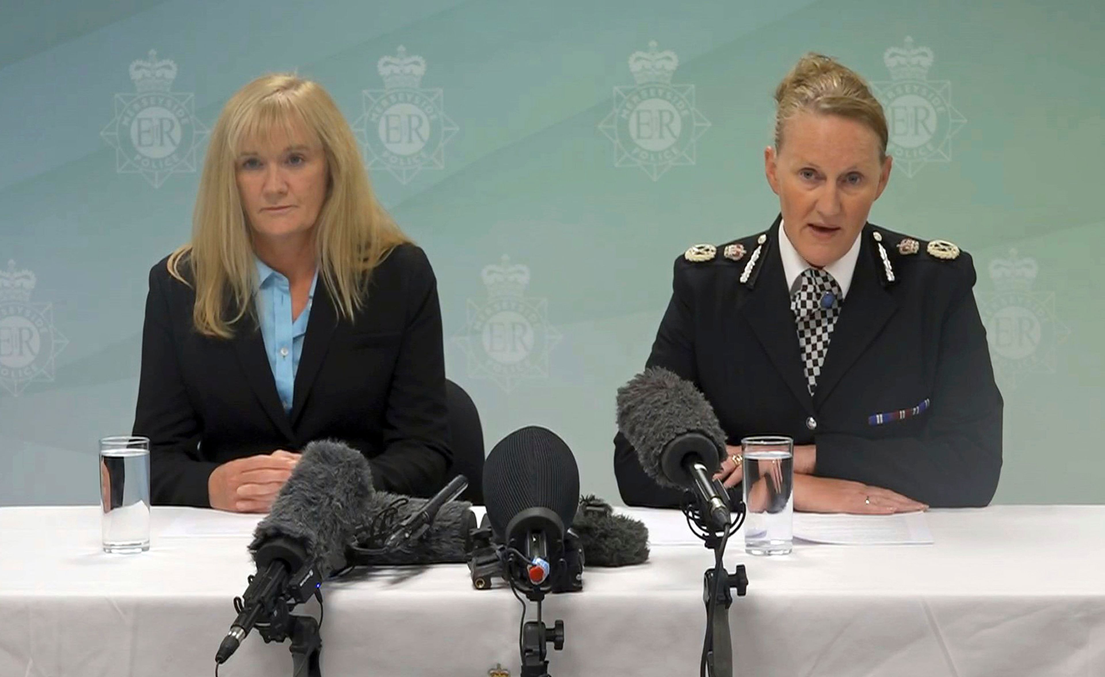 Deputy Chief Crown Prosecutor Ursula Doyle, left, and Merseyside Police Chief Constable Serena Kennedy, speak during a press conference at Merseyside Police Headquarters in Liverpool, England, early Thursday, Aug. 1, 2024, as they announce that a 17-year-old boy has been charged with the murders of three girls at a Taylor Swift-themed holiday club in Southport. The teenager, who has not been named because of his age also faces 10 counts of attempted murder. (Eleanor Barlow/PA via AP)