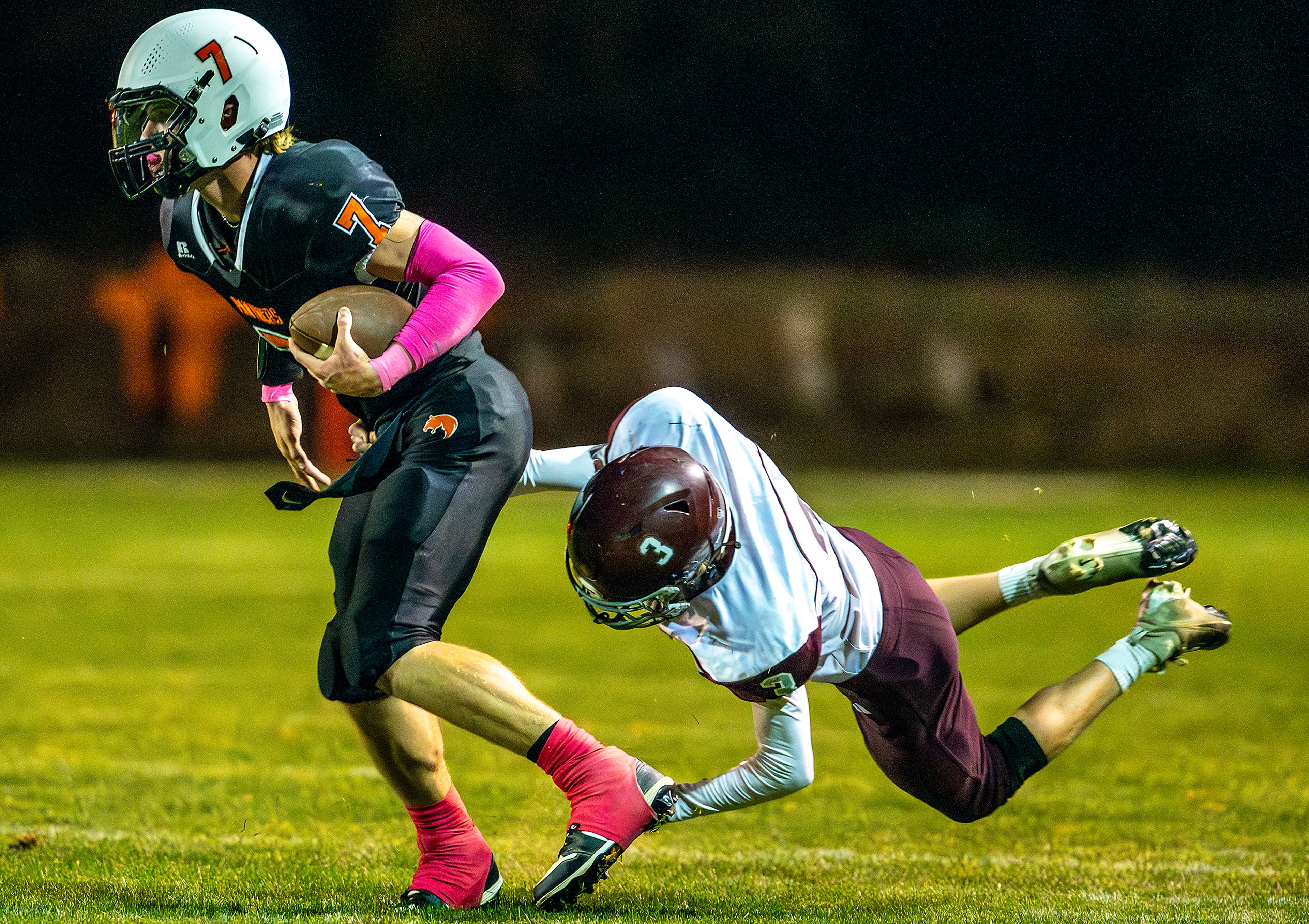 Asotin quarterback Cody Ells avoids a tackle from Reardan’s Landon Smith during a Northeast 2B district game Oct. 11 in Asotin.