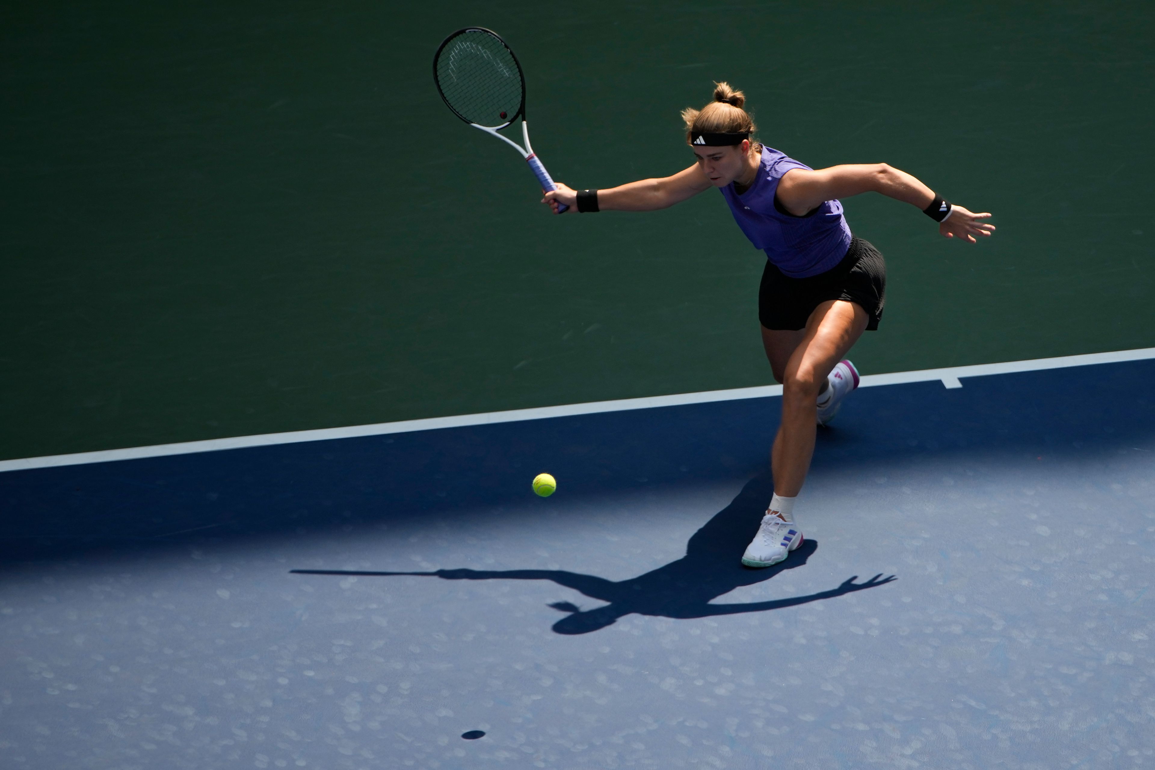 Karolina Muchova, of the Czech Republic, returns a shot to Beatriz Haddad Maia, of Brazil, during the quarterfinals of the U.S. Open tennis championships, Wednesday, Sept. 4, 2024, in New York.