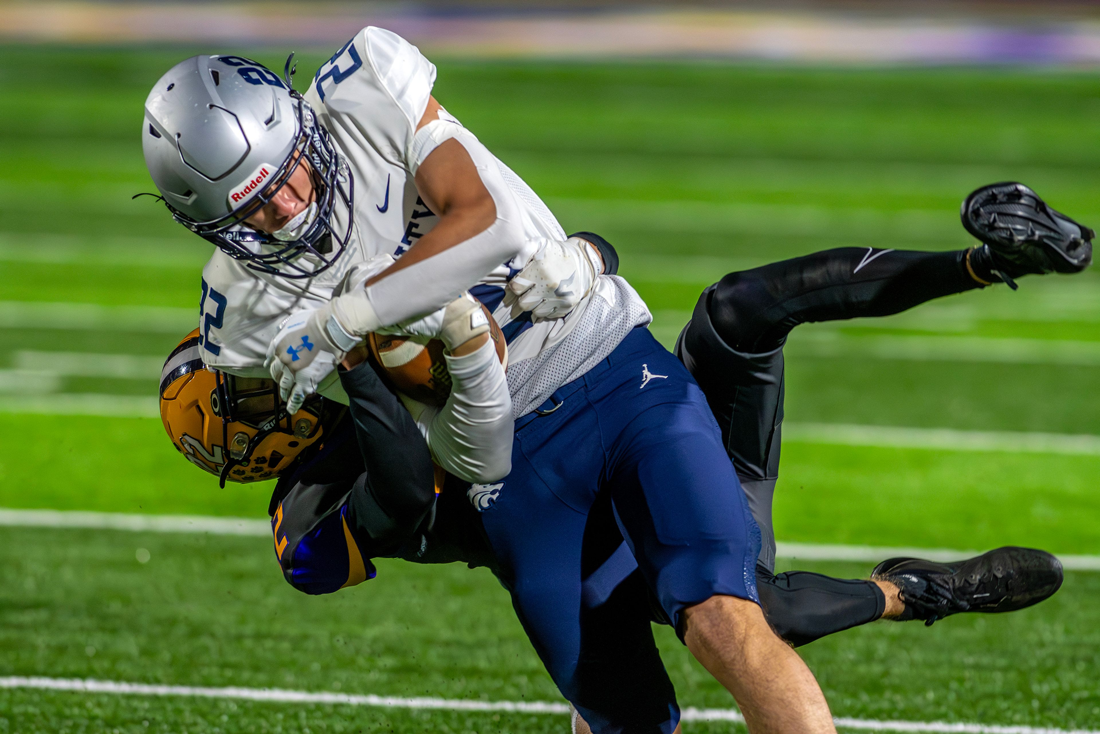 Lewiston defensive back Gage Steiner brings down Lake City running back Gabe Wullenwaber in a nonconference game Friday at Lewiston High School.,