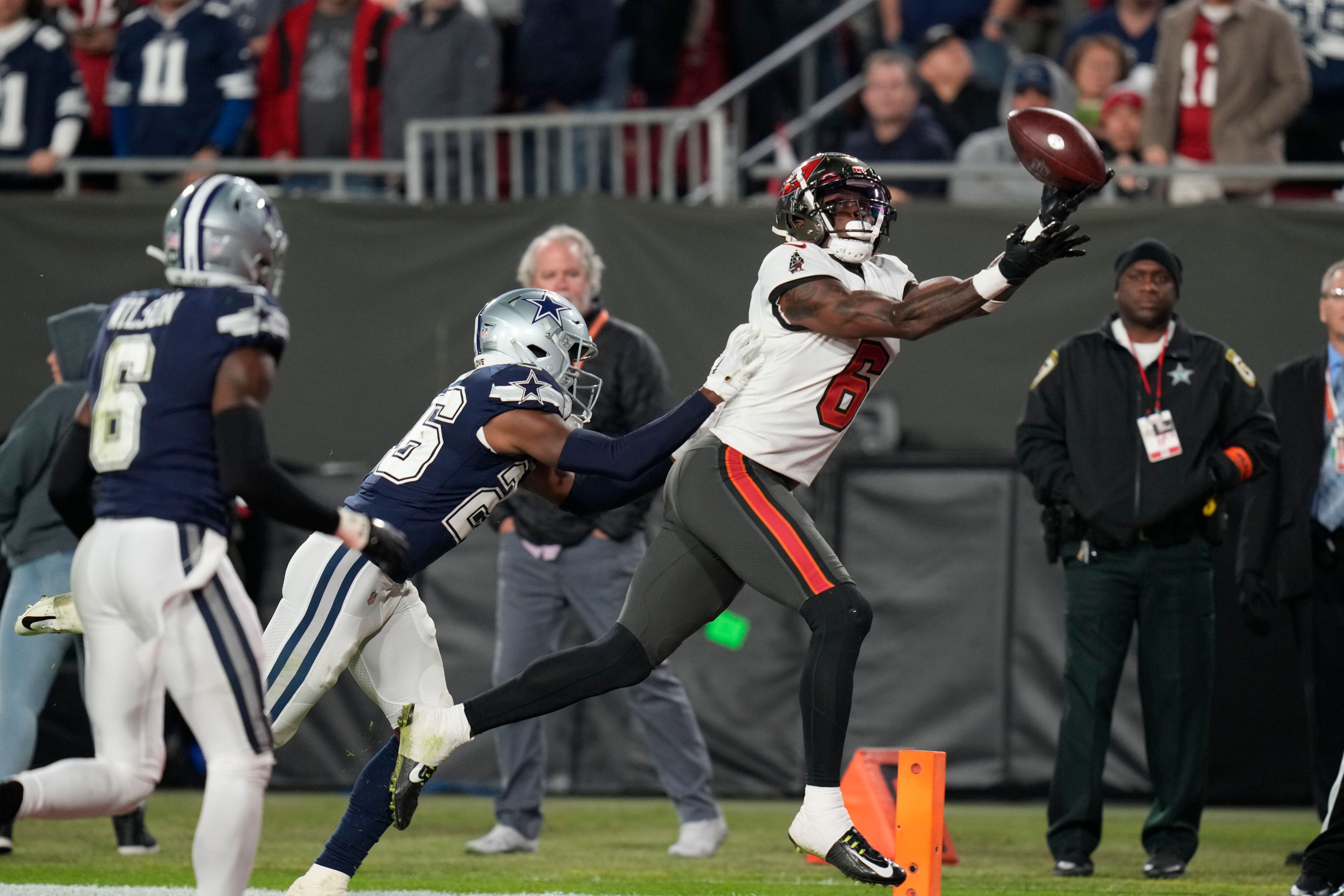 Tampa Bay Buccaneers wide receiver Julio Jones (6) makes the touchdown catch against Dallas Cowboys cornerback DaRon Bland (26) during the second half of an NFL wild-card football game, Monday, Jan. 16, 2023, in Tampa, Fla. (AP Photo/John Raoux)