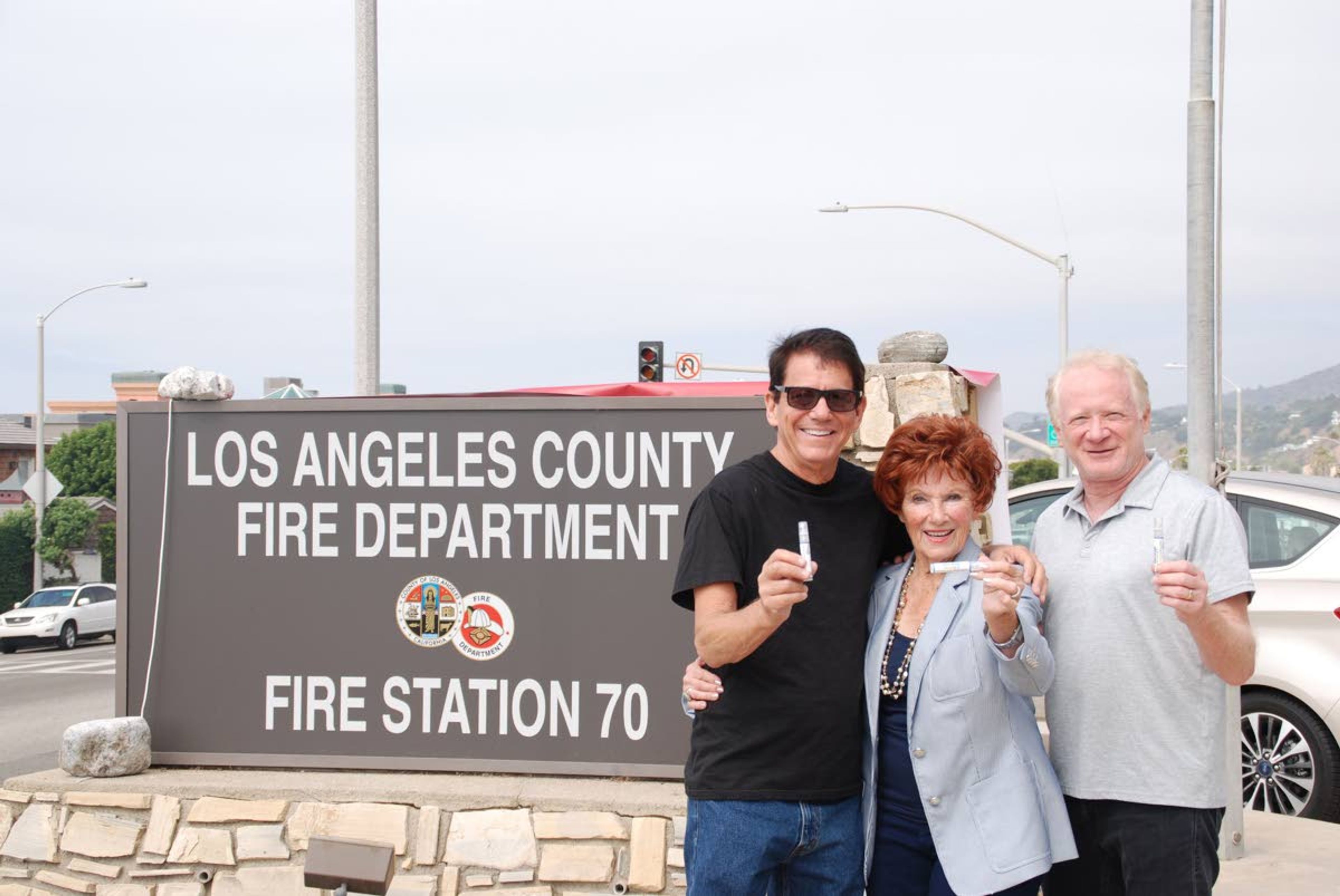 Anson Williams, Marion Ross and Don Most of “Happy Days” fame hold containers of Williams’ latest business venture, Alert Drops.