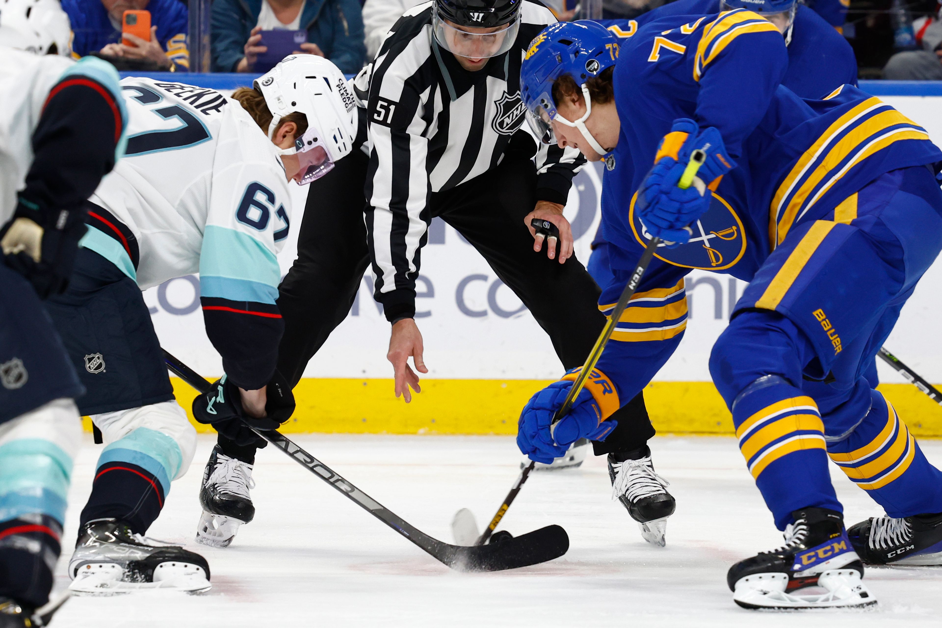 Seattle Kraken center Morgan Geekie (67) and Buffalo Sabres center Tage Thompson (72) battle for the puck during a faceoff during the second period of an NHL hockey game, Tuesday, Jan. 10, 2023, in Buffalo, N.Y. (AP Photo/Jeffrey T. Barnes)