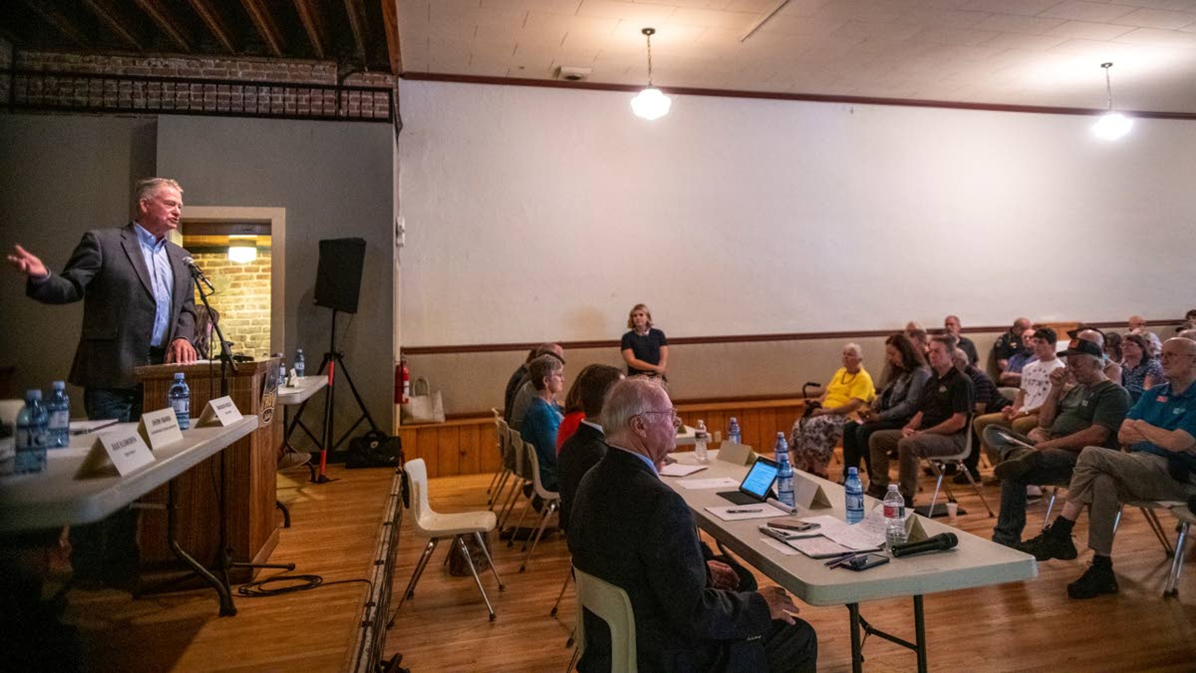 Idaho Gov. Brad Little, left, addresses the crowd during his “Capital for a Day” tour at Troy’s Lions Club on Thursday morning.