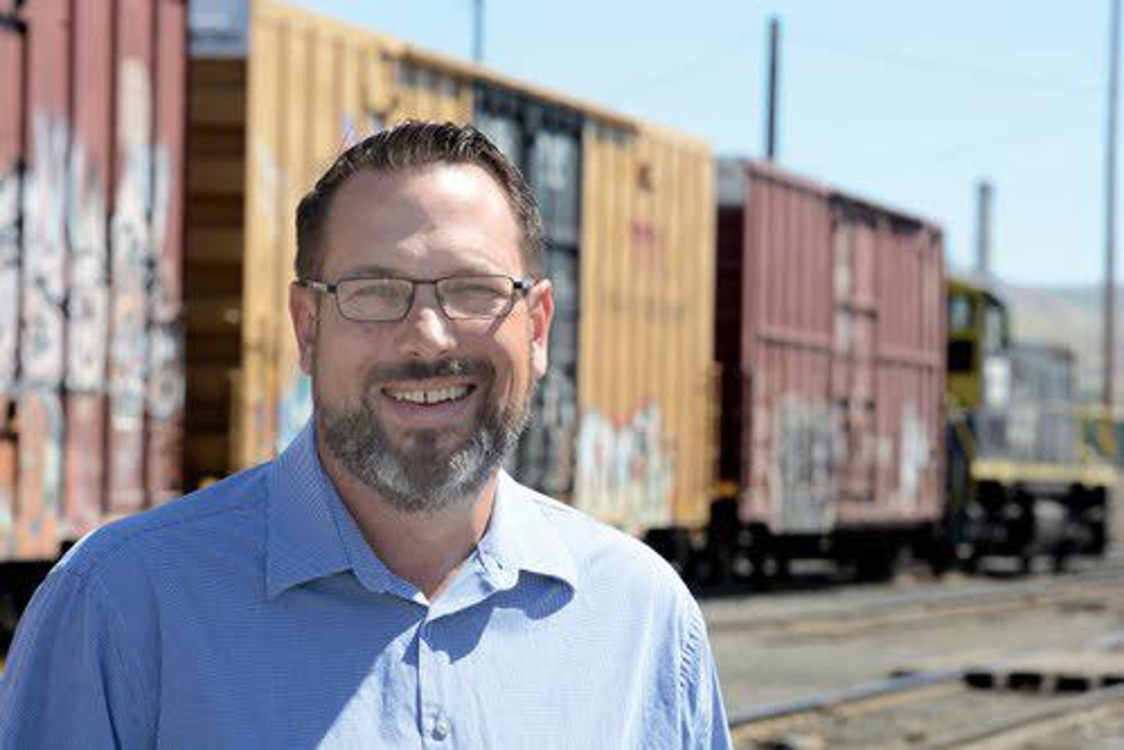 Ted Kadau, vice president-commercial of Watco Companies, stands near rail cars in Lewiston. Watco moves products such as chemicals and lumber in north central Idaho, southeastern Washington and the rest of the nation.