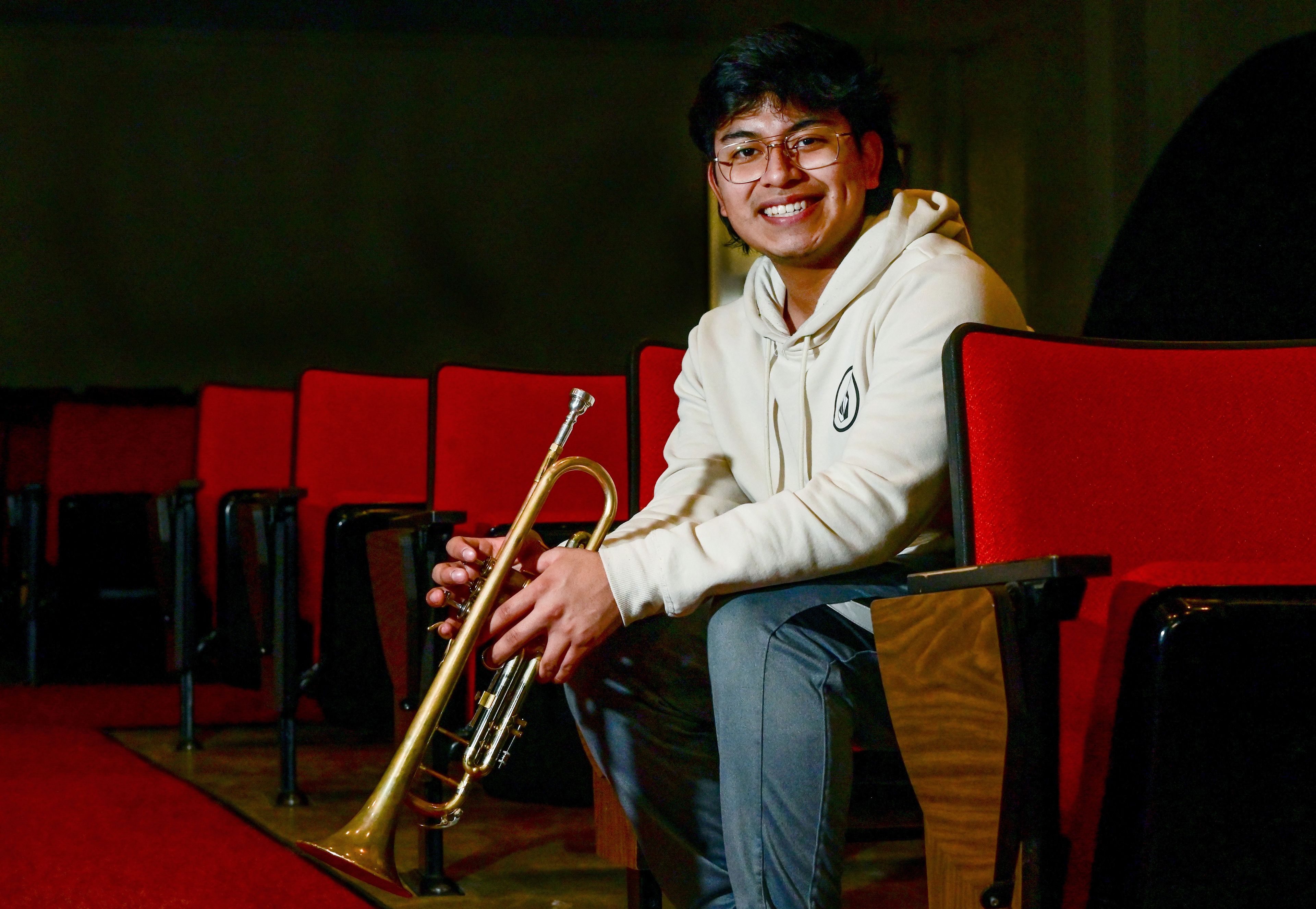 Moscow High School junior James McKinley holds his trumpet in the auditorium at the school on Wednesday. McKinley was selected to play in the 2024 All-American D-Day Band, which will perform in Paris and Normandy.