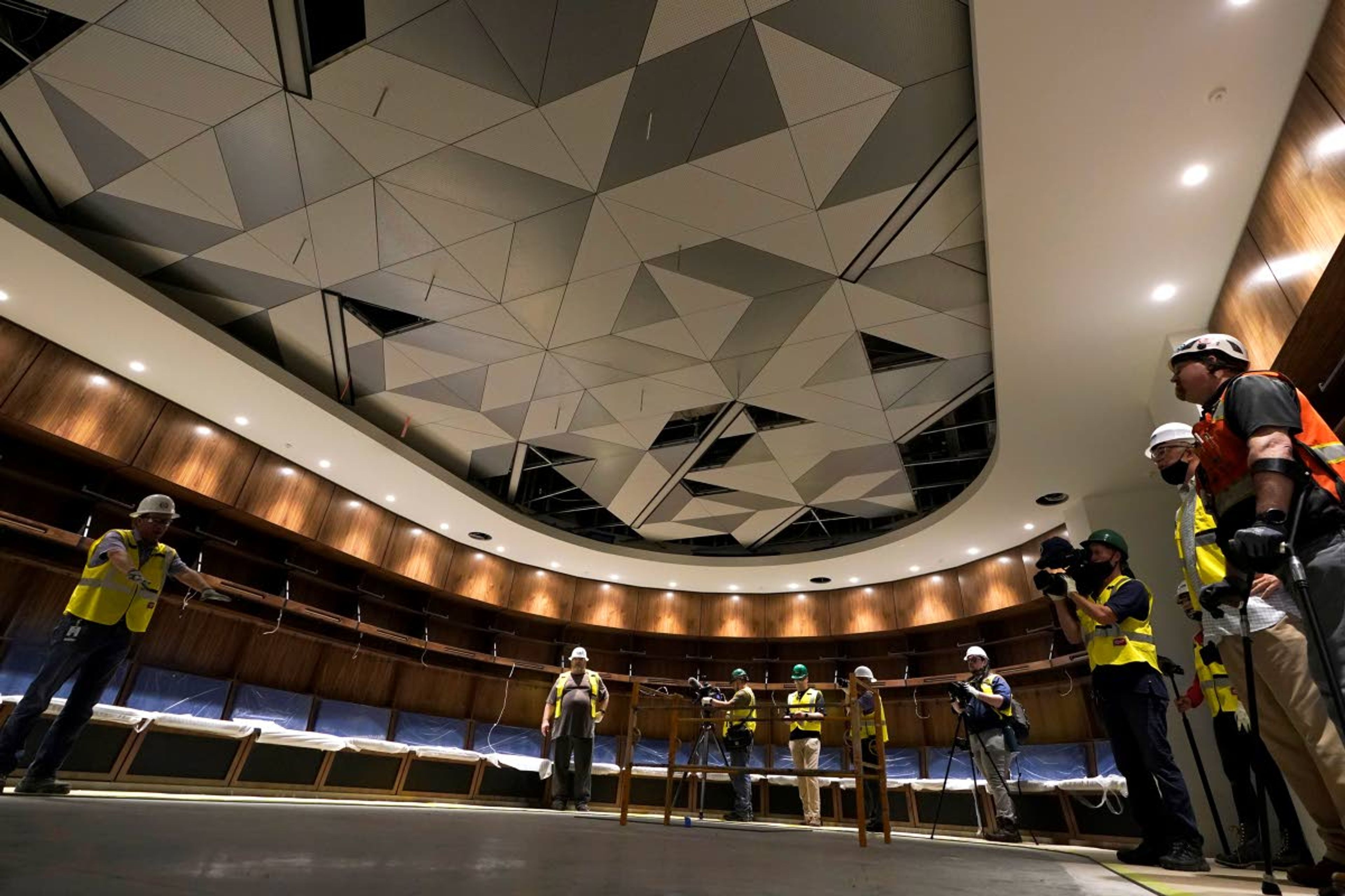 Visitors view the home hockey locker room at Climate Pledge Arena during a media tour of the facility on Monday in Seattle.