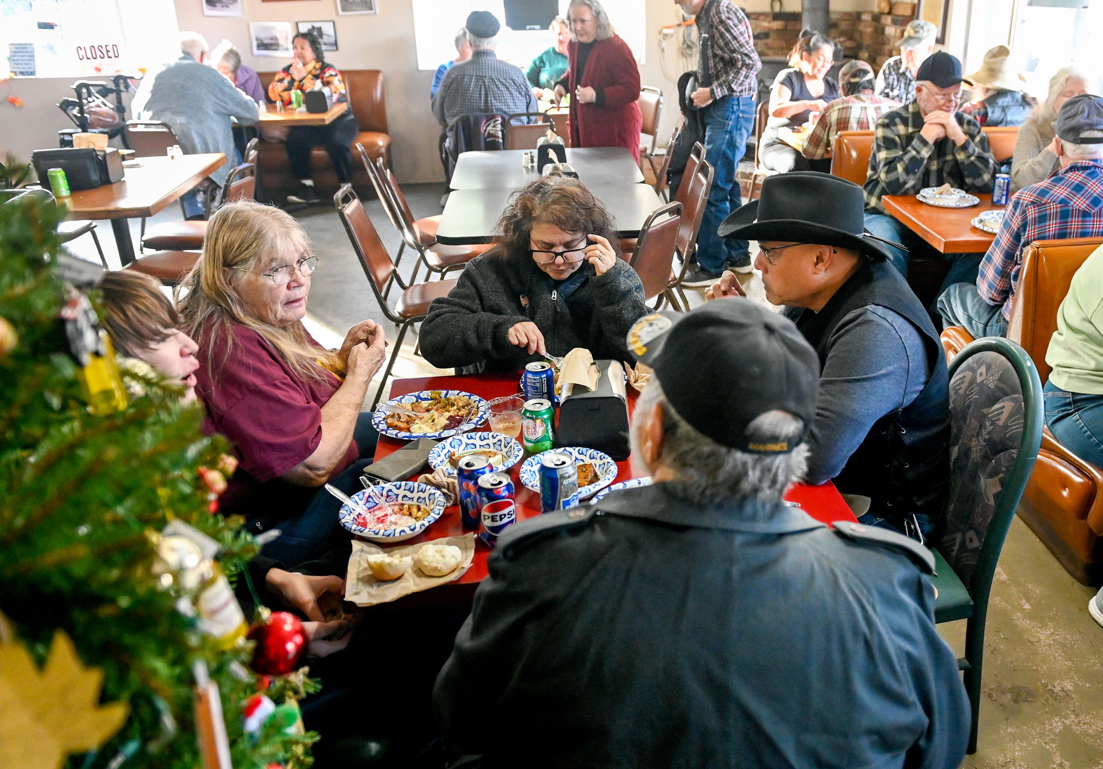 Robert Frenette, from left, gathers with great-grandmother Cathy Frenette, Rose Asmus, Marty Asmus and great-grandfather Bill Frenette Thursday at Waha Grill’s annual free Thanksgiving meal on the outskirts of Lewiston.