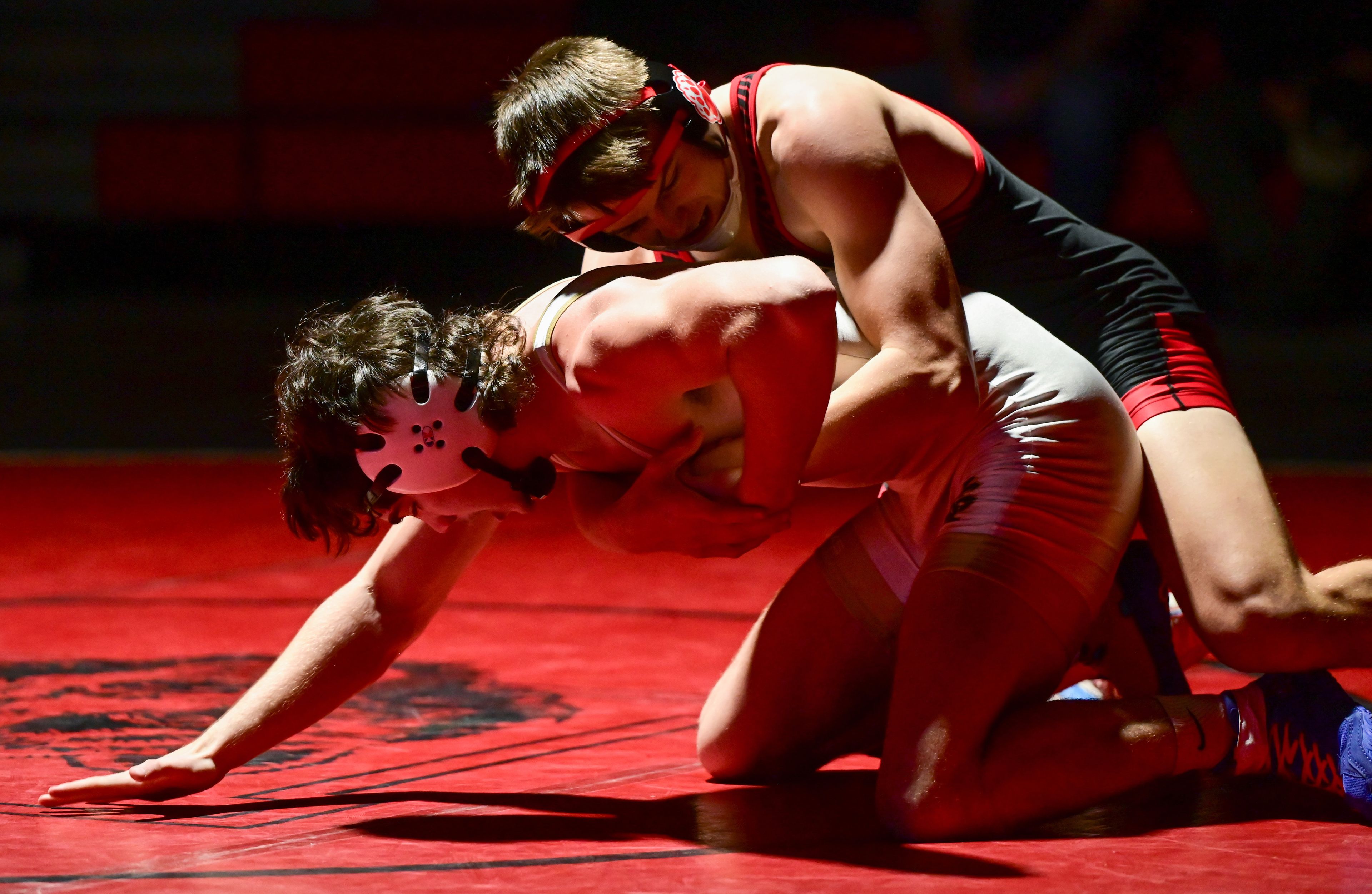 Moscow’s Cameron Vogl attempts to pin St. Maries’ Aiden Yearout during a match Thursday at Bear Den in Moscow.