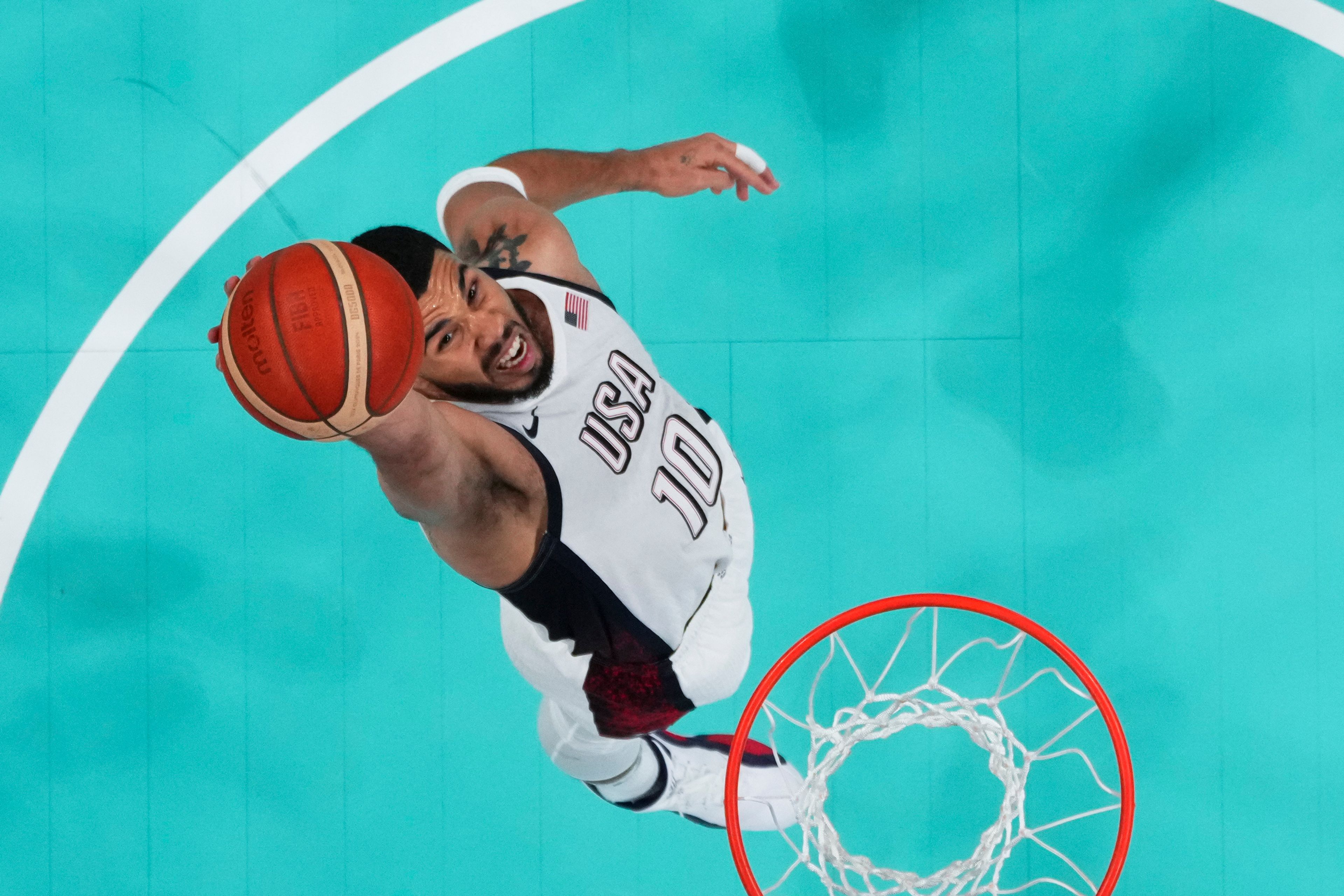 Jayson Tatum, of the United States, grabs a rebound against South Sudan at the 2024 Summer Olympics, Wednesday, July 31, 2024, in Villeneuve-d'Ascq, France. (Brian Snyder/Pool Photo via AP)