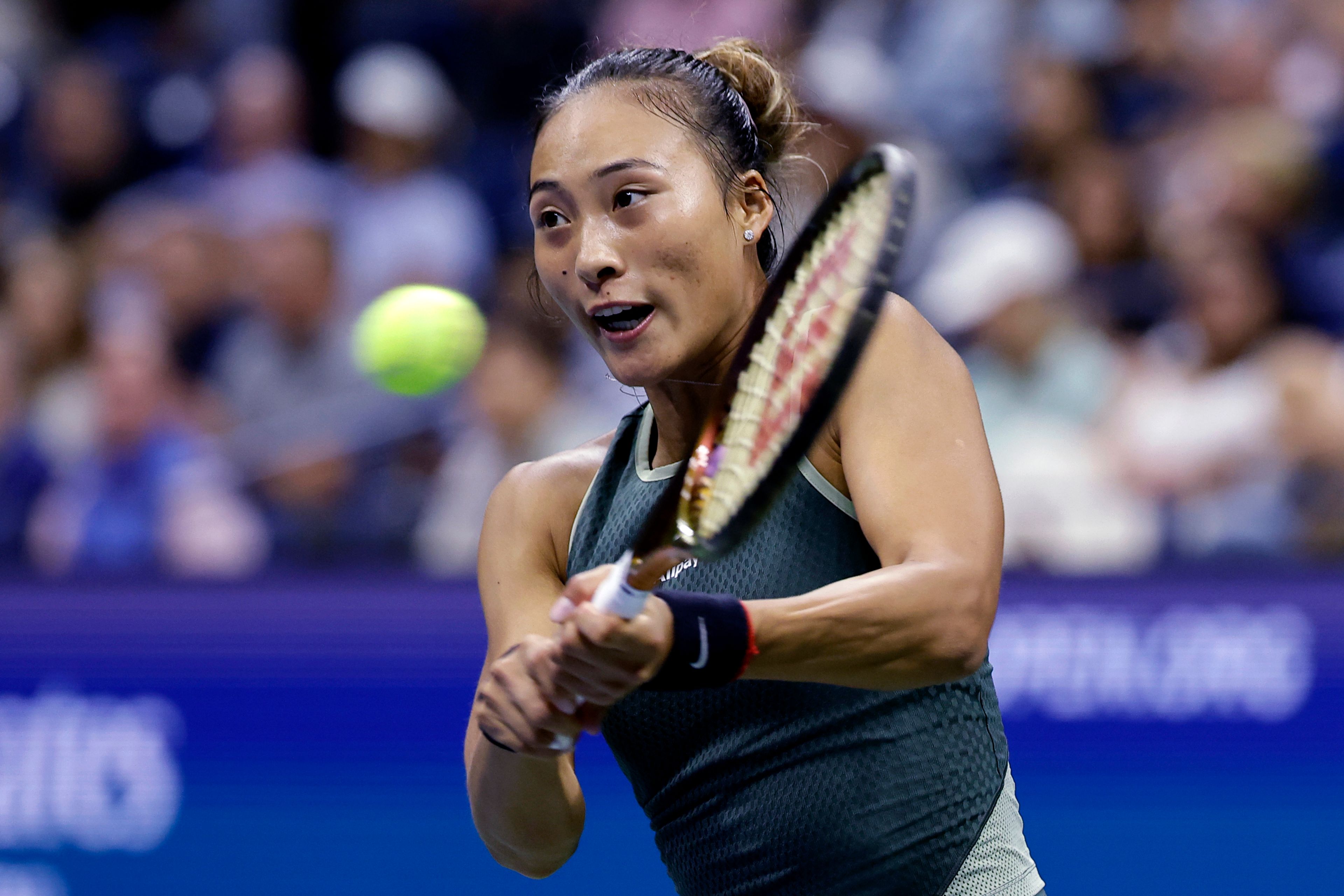 Zheng Qinwen, of China, returns to Aryna Sabalenka, of Belarus, during the quarterfinals of the U.S. Open tennis championships, Tuesday, Sept. 3, 2024, in New York.