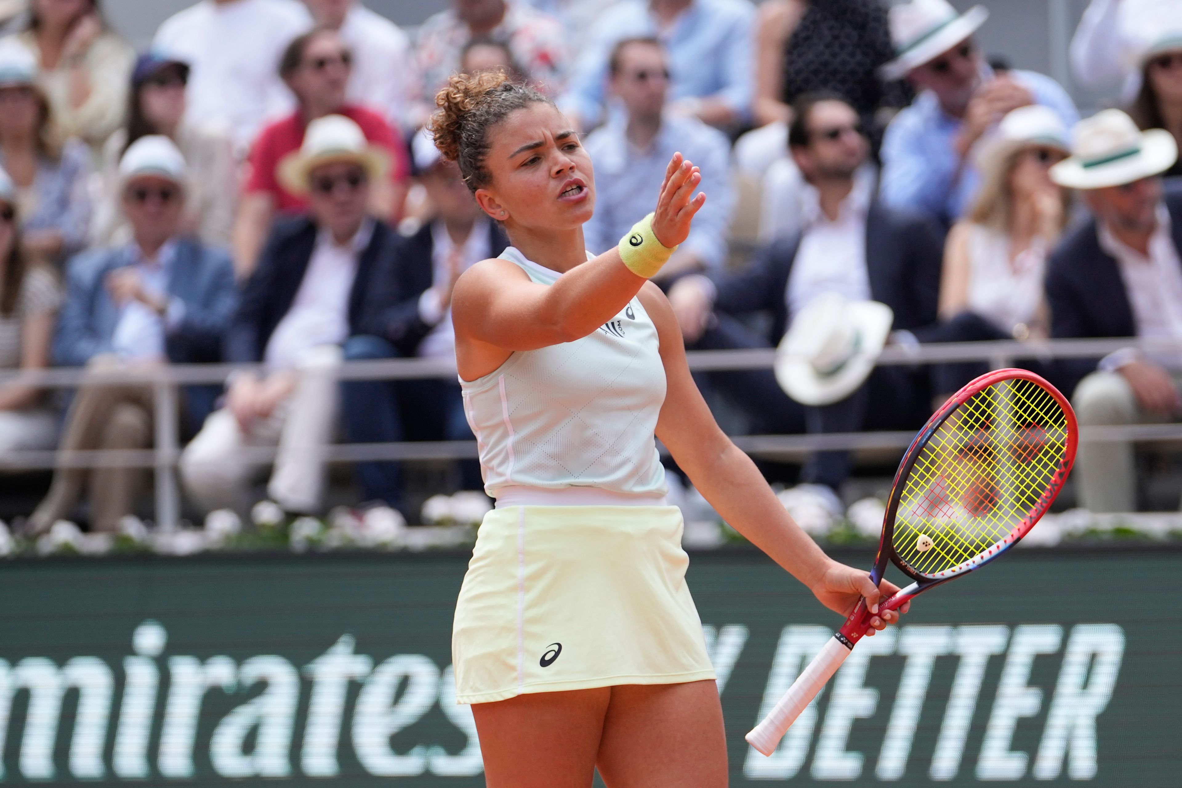 Italy's Jasmine Paolini reacts after missing a shot against Poland's Iga Swiatek during the women's final of the French Open tennis tournament at the Roland Garros stadium in Paris, France, Saturday, June 8, 2024.