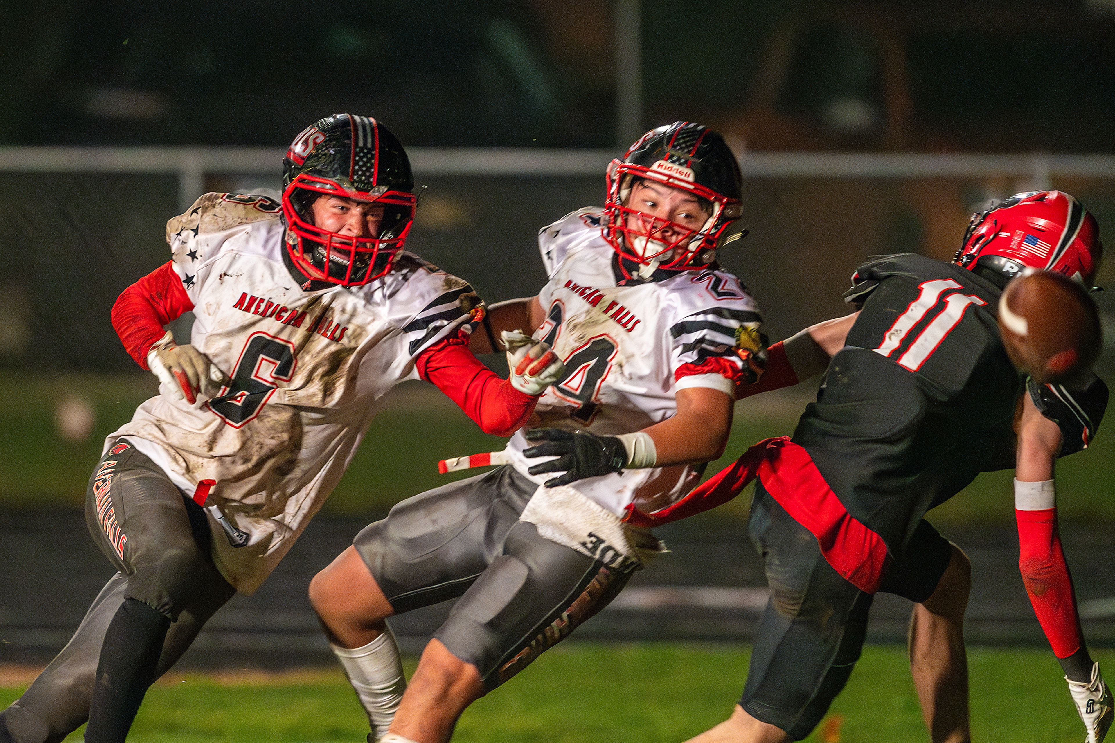 American Falls' Zak Grigg, left, and Brian Lopez break up a pass intended for Moscow wide receiver Graysen Hennrich in the end zone during an Idaho 4A playoff game Friday in Moscow.