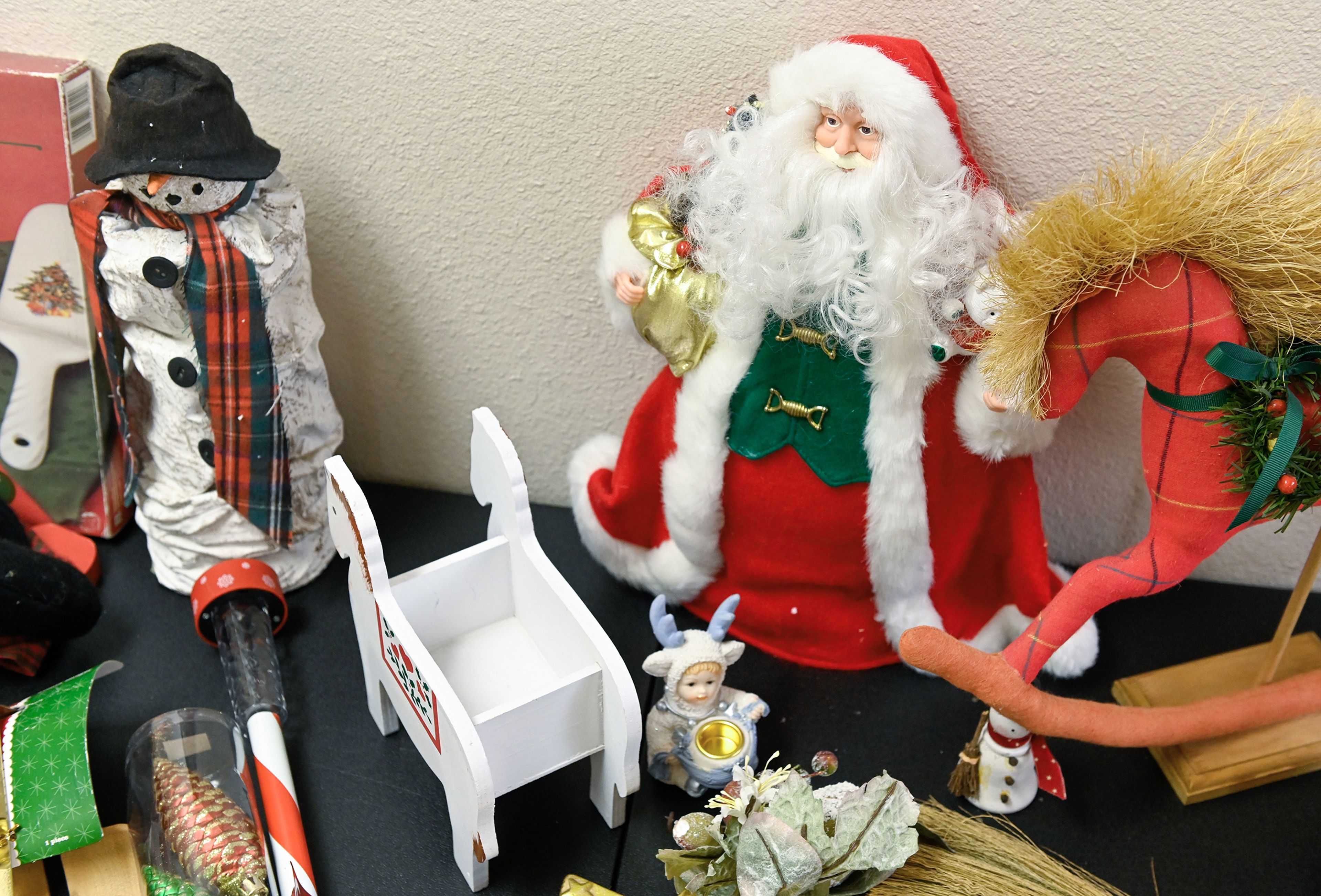 Christmas-related items, selling for $1, each are displayed on tables Wednesday at Cooper’s Legacy Foundation Resale Shop in Pullman.