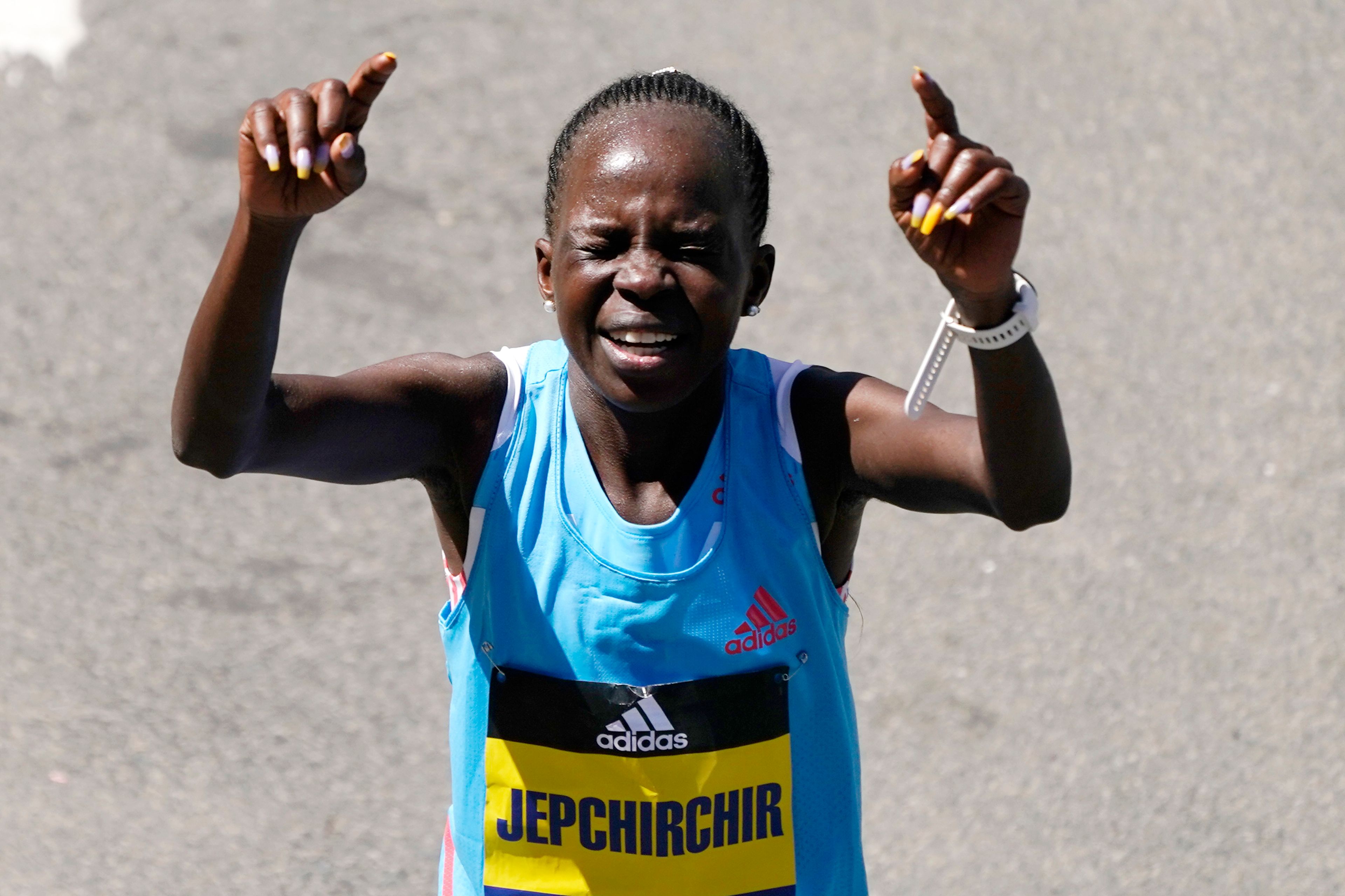 Peres Jepchirchir, of Kenya, reacts after winning the women's division of the Boston Marathon, Monday, April 18, 2022, in Boston. (AP Photo/Charles Krupa)