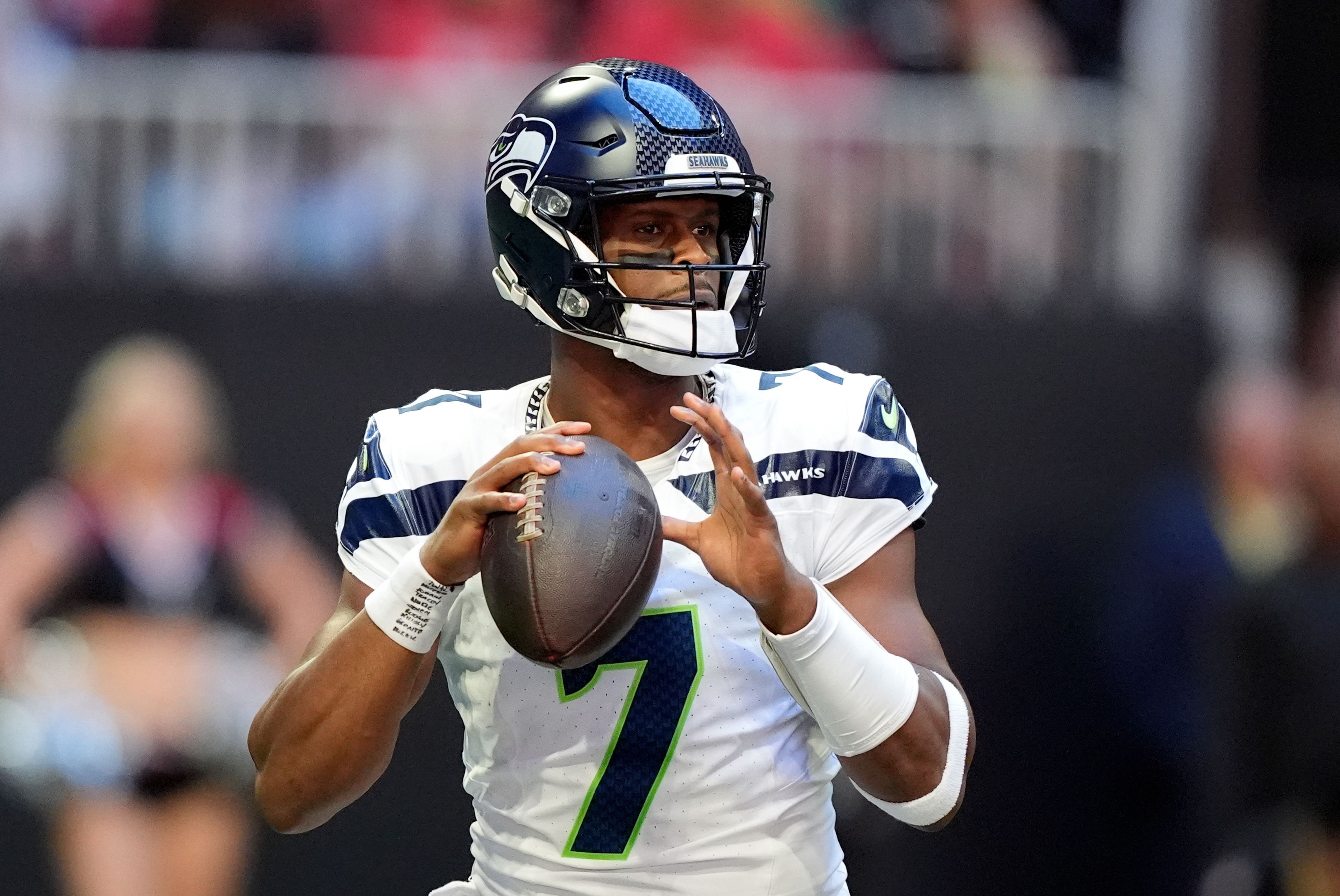 Seattle Seahawks quarterback Geno Smith (7) looks for an open receiver during the first half of an NFL football game against the Atlanta Falcons, Sunday, Oct. 20, 2024, in Atlanta. (AP Photo/ Brynn Anderson )