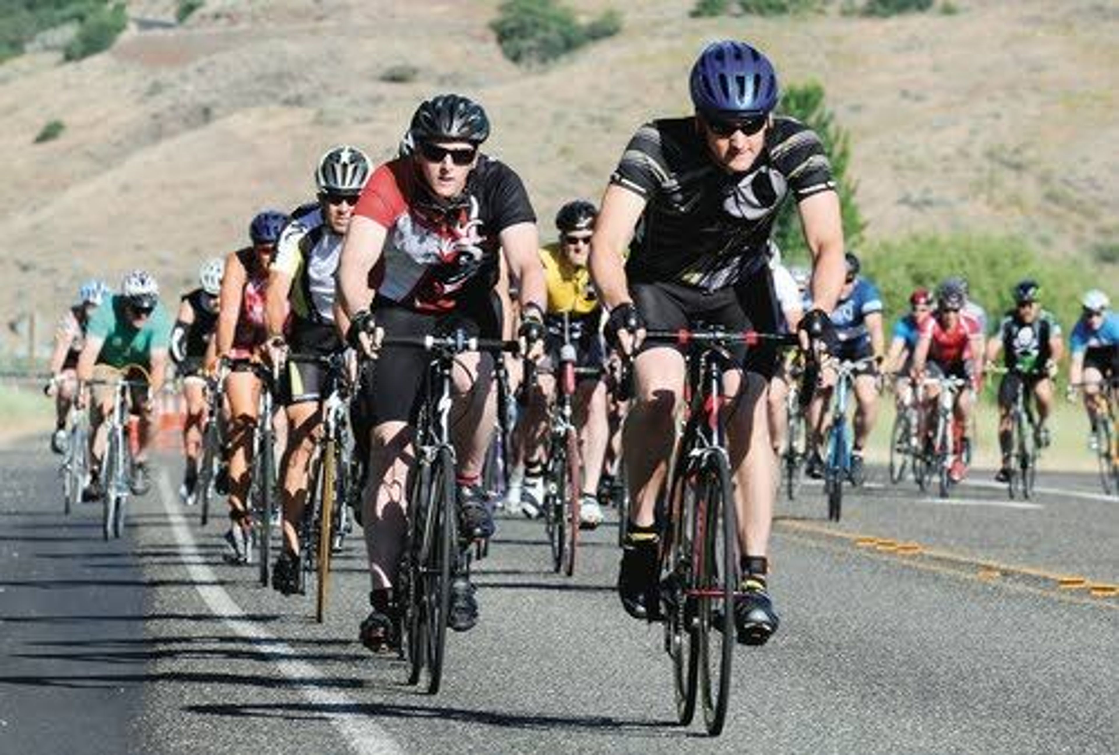 The lead group forms up as cyclists file out of Chief Timothy Park west of Clarkston in the I Made the Grade race. There were 170 riders registered for the race and 144 of them made it to the top of the Old Spiral Highway on Saturday morning.