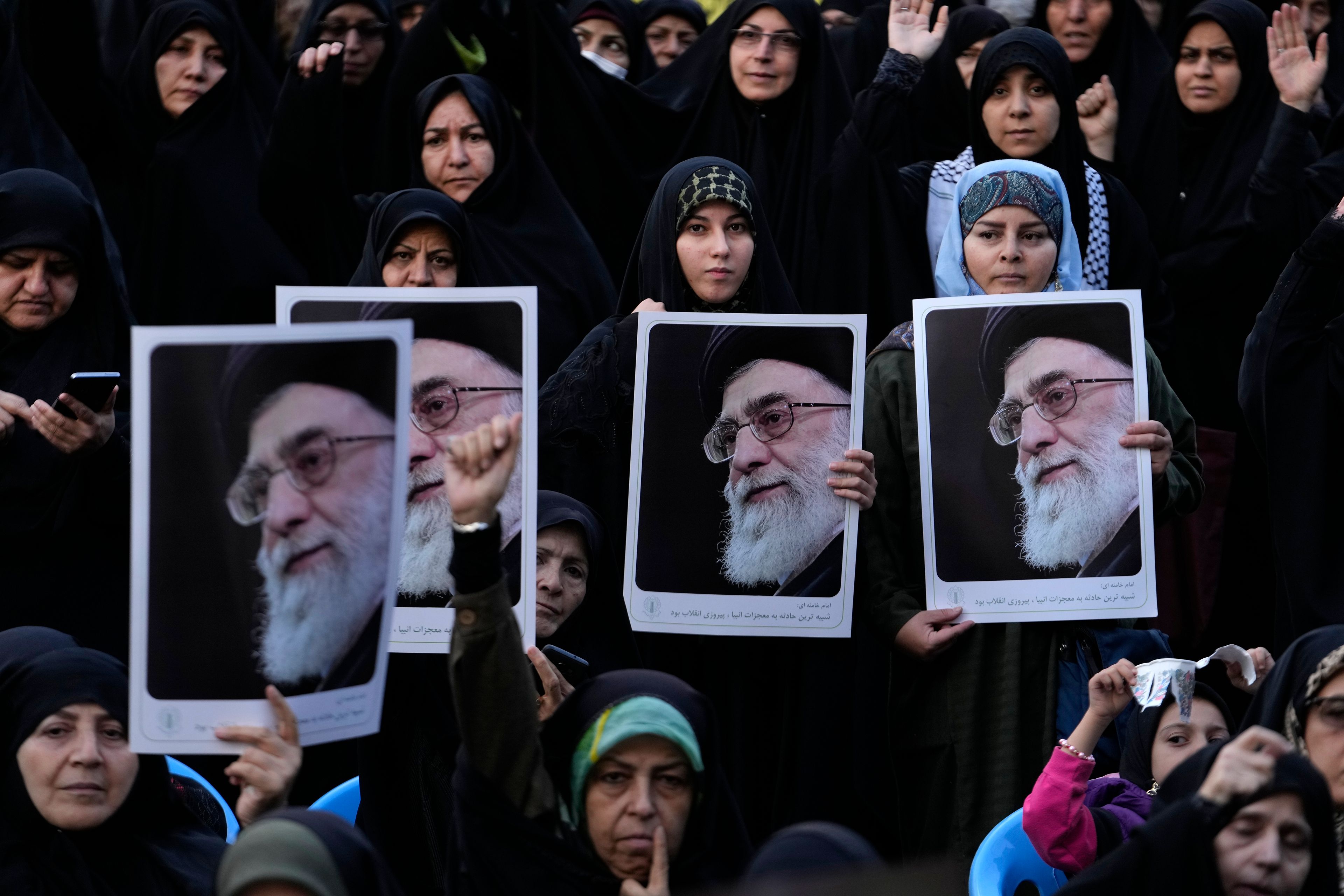 Iranian demonstrators hold posters of the Supreme Leader Ayatollah Ali Khamenei in a ceremony commemorating the late Hamas leader Yahya Sinwar and Hashem Safieddine, a powerful cleric who was expected to succeed slain Hezbollah leader Hassan Nasrallah and was killed by an Israeli airstrike in Beirut, at the Felestin (Palestine) Sq. in Tehran, Iran, Thursday, Oct. 24, 2024. (AP Photo/Vahid Salemi)