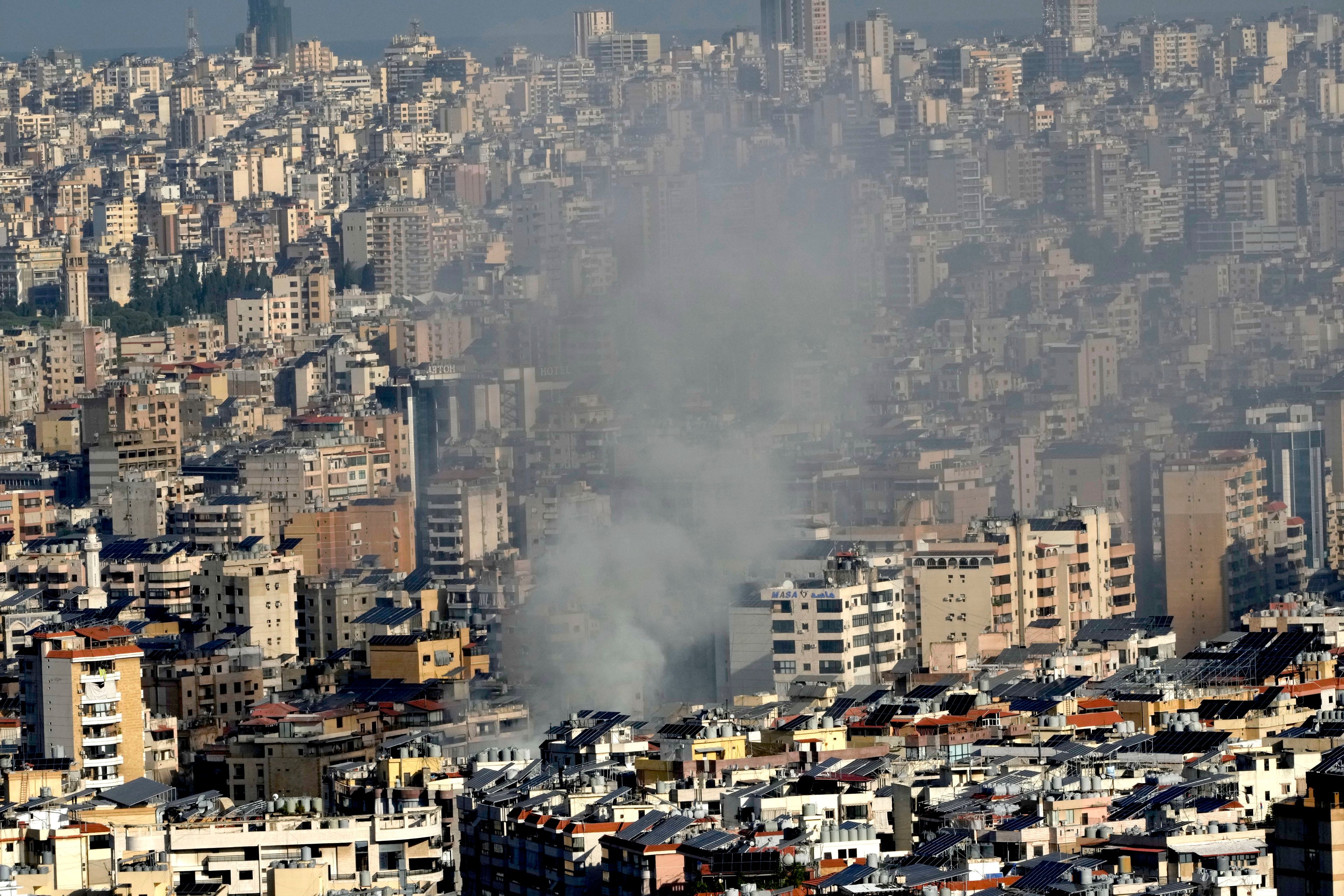 Smoke rises a neighborhood that was hit by an Israeli airstrike in Dahieh, Beirut, Lebanon, Wednesday, Oct. 2, 2024. (AP Photo/Hussein Malla)