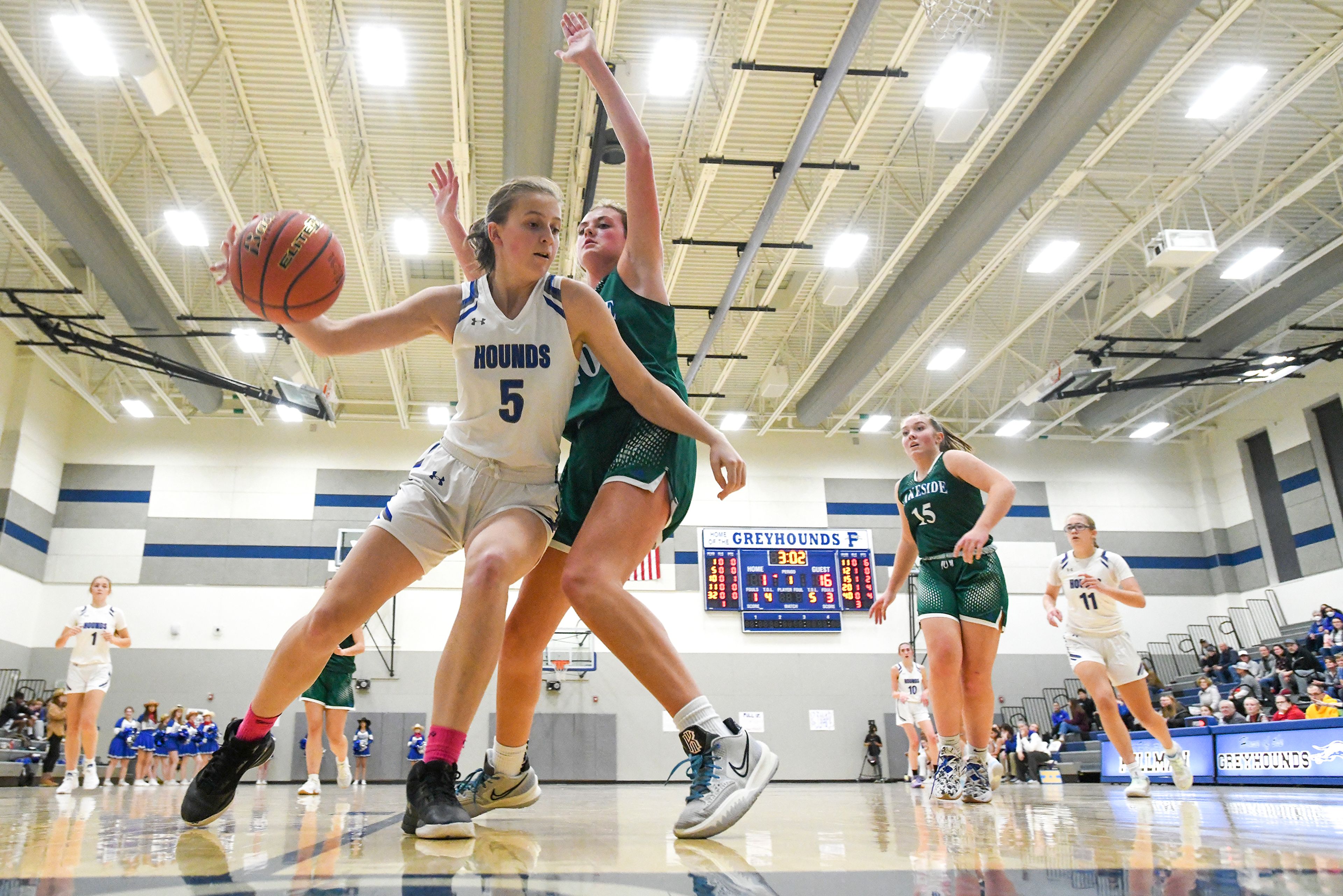 Pullman post Sophie Armstrong dribbles along the baseline as Lakeside guard Paige Larson defends during Friday's nonleague game.