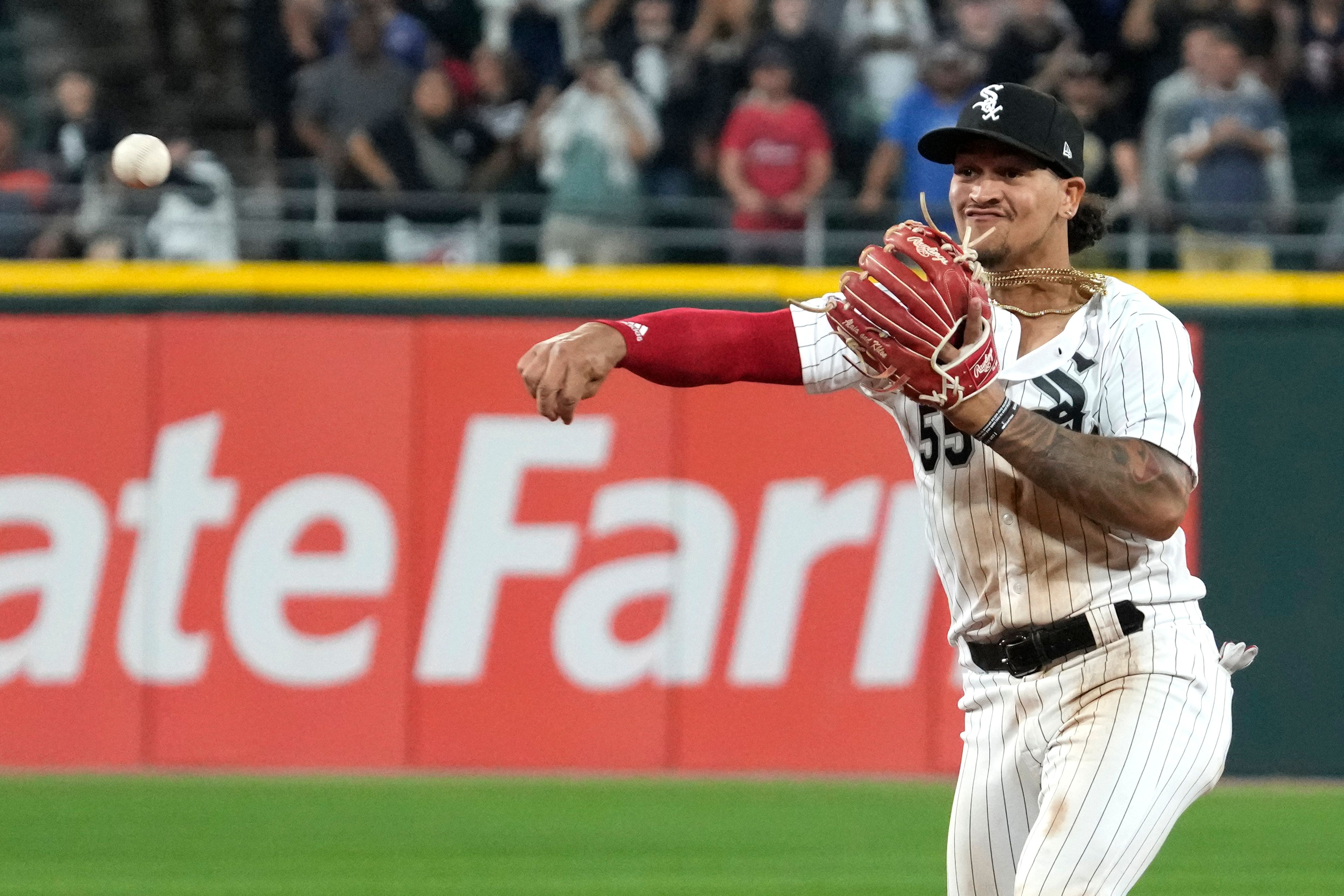 FILE - Chicago White Sox second baseman Jose Rodriguez throws out Texas Rangers' Jonah Heim at first base during the ninth inning of a baseball game in Chicago, Tuesday, June 20, 2023. Major League Baseball, on Tuesday, June 4, 2024, banned Rodriguez for one year after finding the player placed unrelated bets with a legal sportsbook.