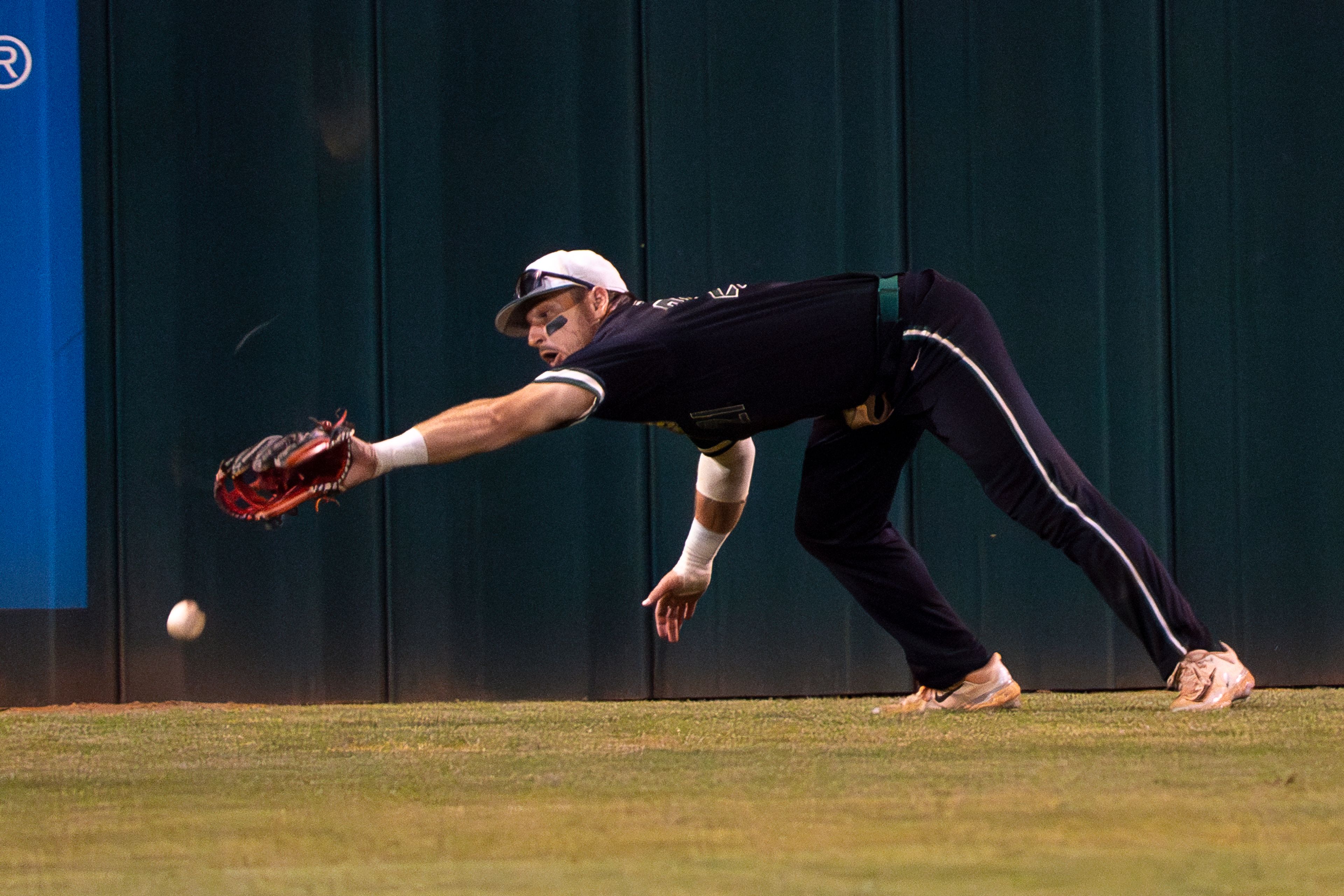 Georgia Gwinnett center fielder Ajay Sczepkowski is unable to catch a fly ball during Game 12 of the NAIA World Series against Tennessee Wesleyan on Monday at Harris Field in Lewiston.